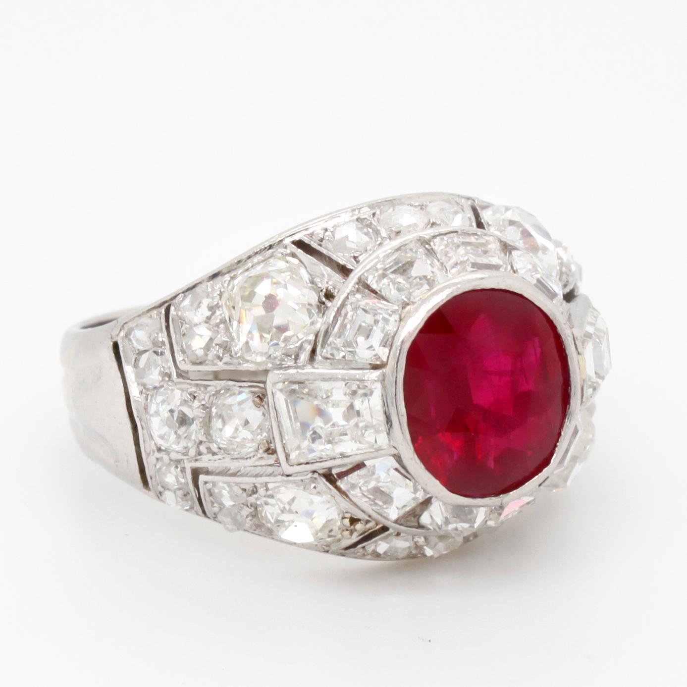 Wonderful Art Deco ring set with an intense vivid red Burma ruby (approx. 2ct). 
Old cut and calibré cut diamonds are placed in a dome shape setting around the ruby. 
Total diamonds weight is approximately 2,5ct and near colourless (G-I/VS).

Ring