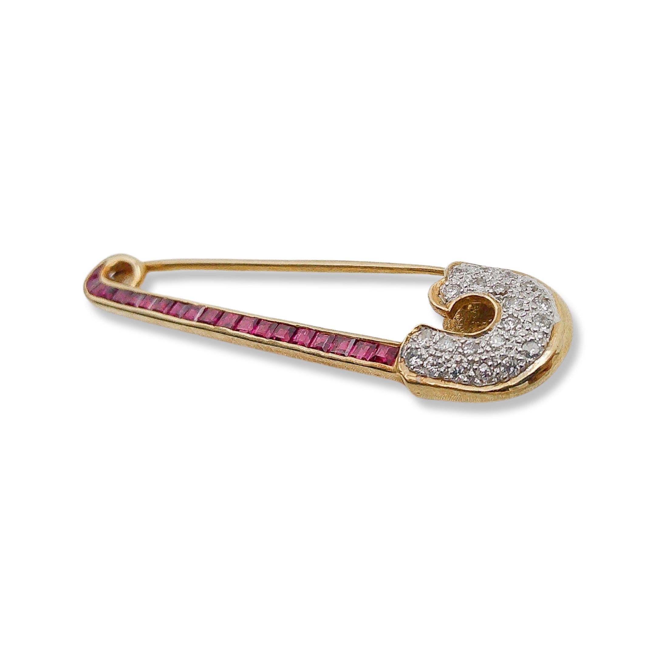This opulent Art Deco 18k Ruby and Diamond Safety Pin was handcrafted sometime during the Art Deco design period (1920-1940). Inspired by the geometric designs and luxurious motifs of the Art Deco era, our safety pin encapsulates the charm of a