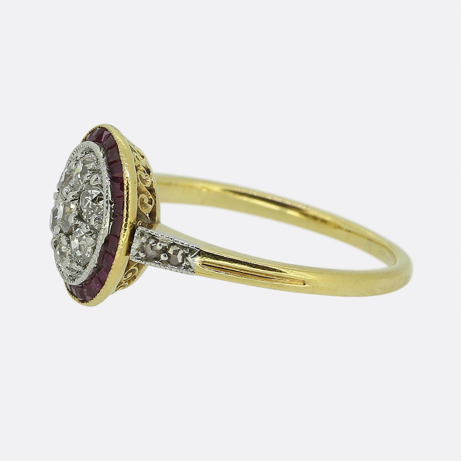 Here we have a lovely ruby and diamond target ring crafted at a time when the Art Deco style was at the height of design. A cluster of round faceted old cut diamonds have been individually claw set at the centre of the face in a fine milgrain