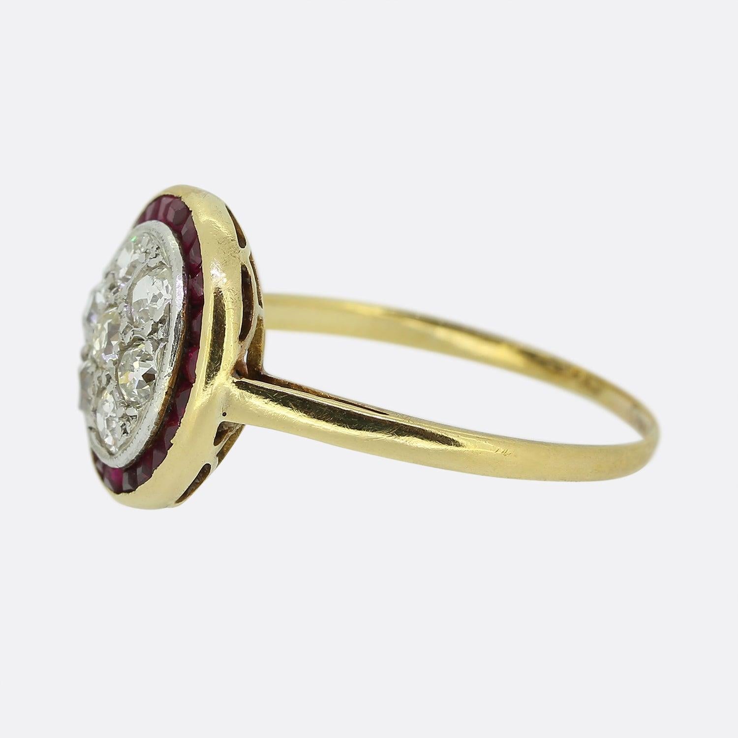 Here we have a marvellous ruby and diamond target ring crated at a time when the Art Deco style was at the height of design. A cluster of round faceted old cut diamonds have been set at the centre of the face in a fine milgrain platinum frame. These