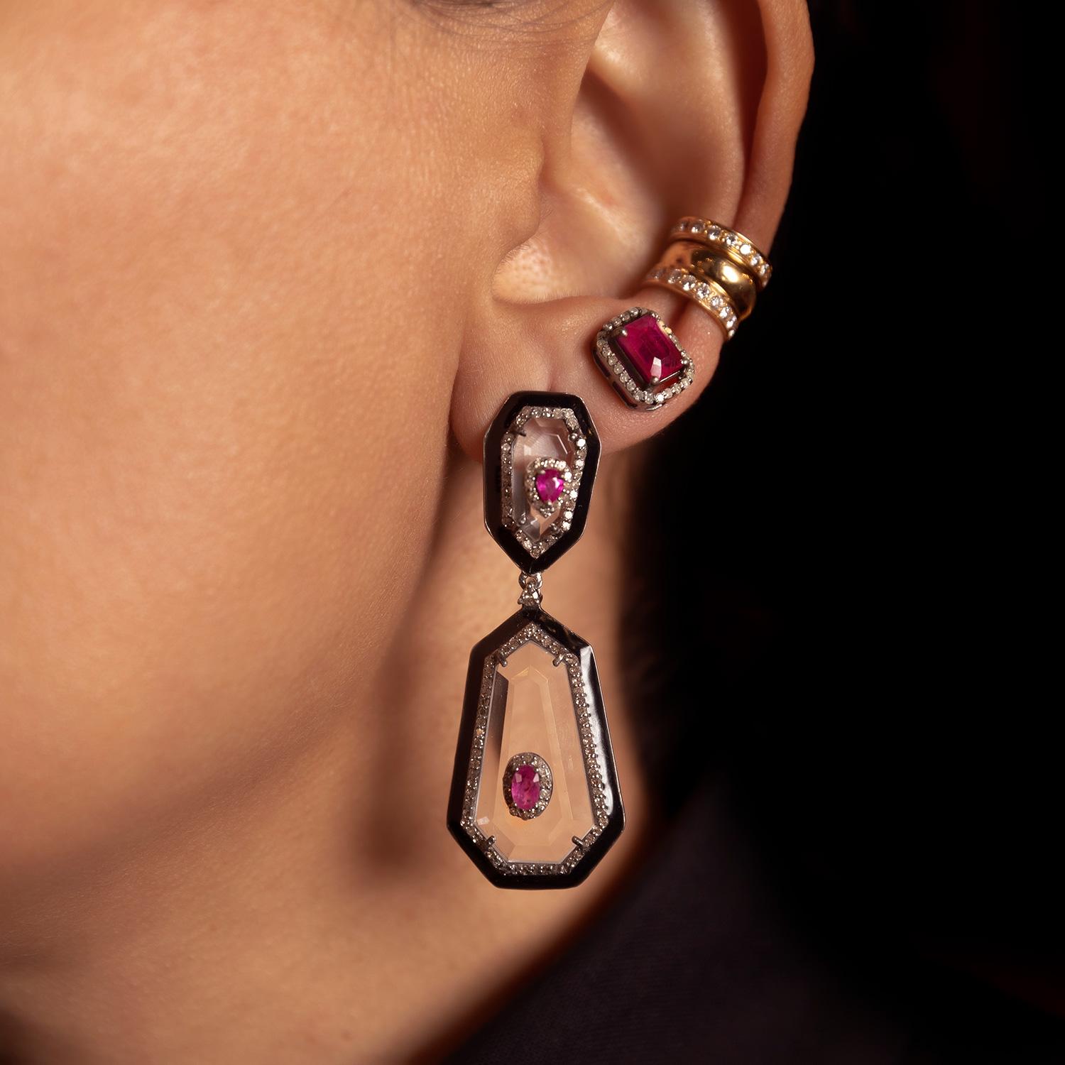 Featuring 0.78 carat of natural consciously sourced rubies,1.49 carat of small single cut diamonds & 17 carat of Mother of Pearl, detailed with black enamel borders.

Set on 925 silver (8.56 grams) & 14kt gold (0.93 grams).

4.7 cm in full