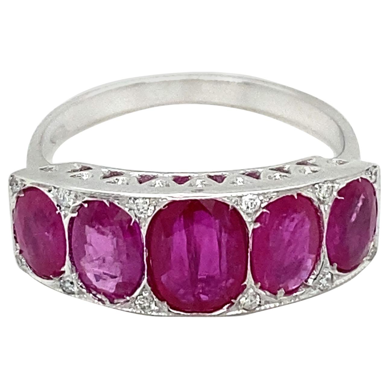 Charming Ruby Diamond Gold ring, all handmade in the Art Deco era, in excellent condition. It is set with five vivid Large Natural Rubies, total weight 3.00 carats, and adorned by 0,12 carat of sparkling Round brilliant cut Diamonds graded F color