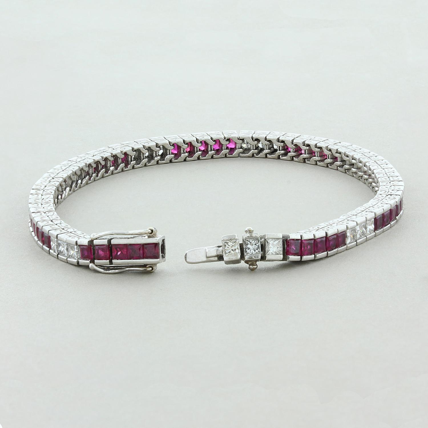A delicately smooth and flexible bracelet from the end of the Art Deco era, this piece featuring 5.00 carats of princess cut red rubies alternating with approximately 1.50 carats of princess cut diamonds. This timeless bracelet is in a platinum