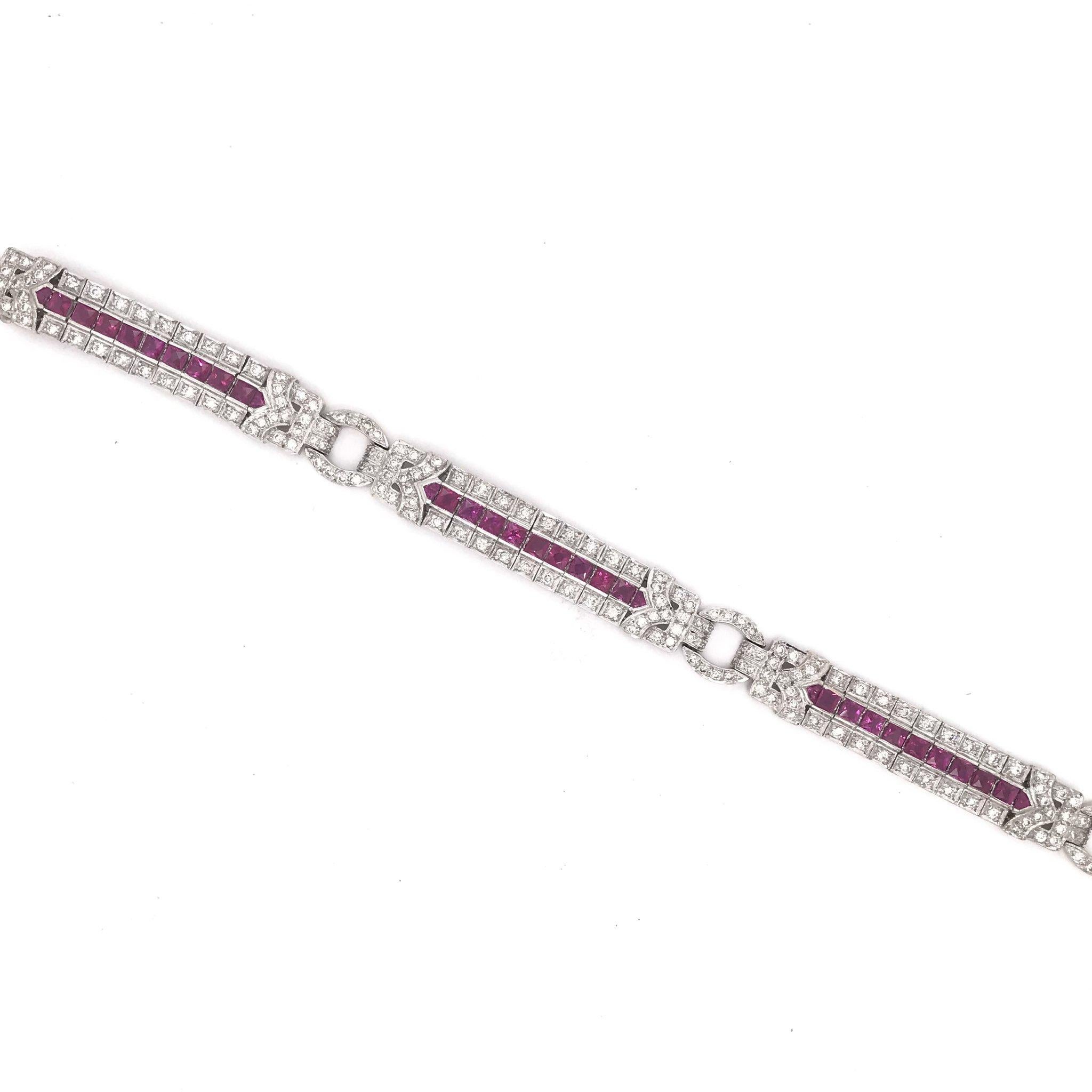 This Art Deco styled bracelet is absolutely unforgettable, featuring 192 diamonds and 33 vibrant rubies. Dripping in the decadence of the roaring twenties this piece has a combined total diamond weight of approximately 2.50 carats and a combined