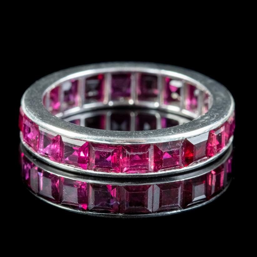 A gorgeous Art Deco full eternity ring set with twenty square cut rubies around the outside of the band. They have a desirable cherry pink hue and weigh approx. 0.18ct each making a grand total of approx. 3.60ct.

Eternity rings have been given as a