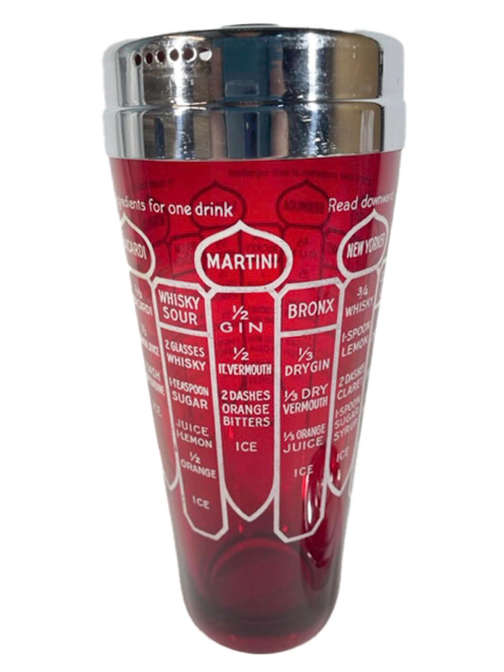 Art Deco ruby red glass recipe cocktail shaker with 14 recipes in white enamel text and graphics. The two-part chrome lid has a built-in ice dam and strainer.