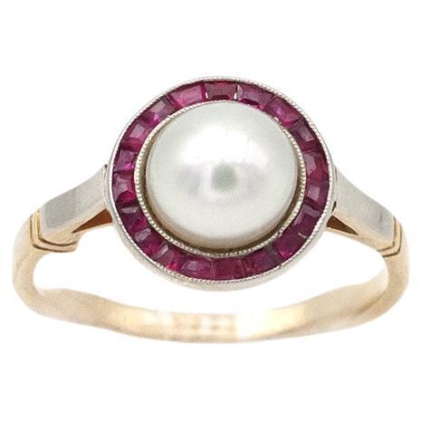 Art Deco ruby pearl halo ring in 18 karat gold and platinum, target ring
