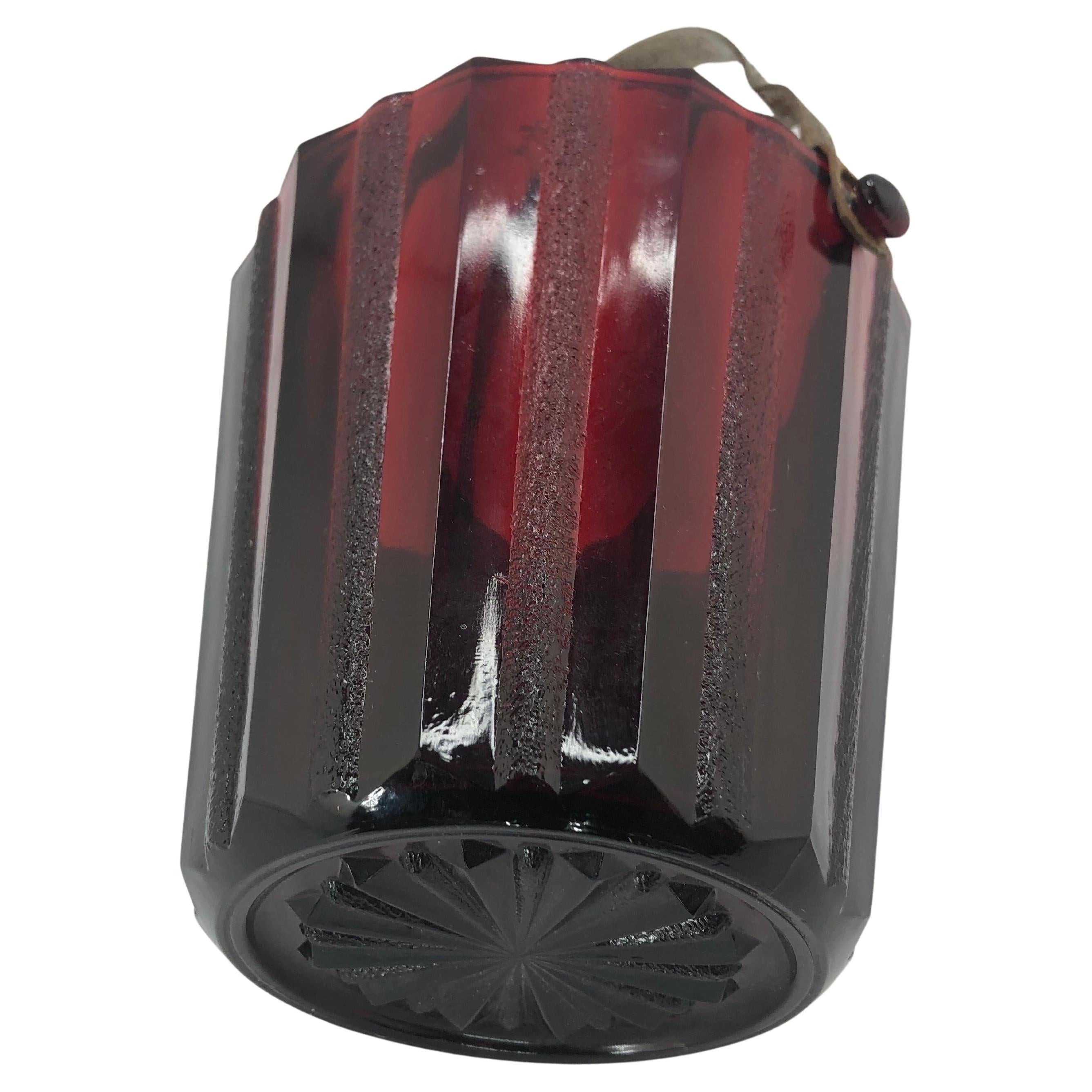 Art Deco Ruby Red Glass Ice Bucket with chrome handle and tongs.