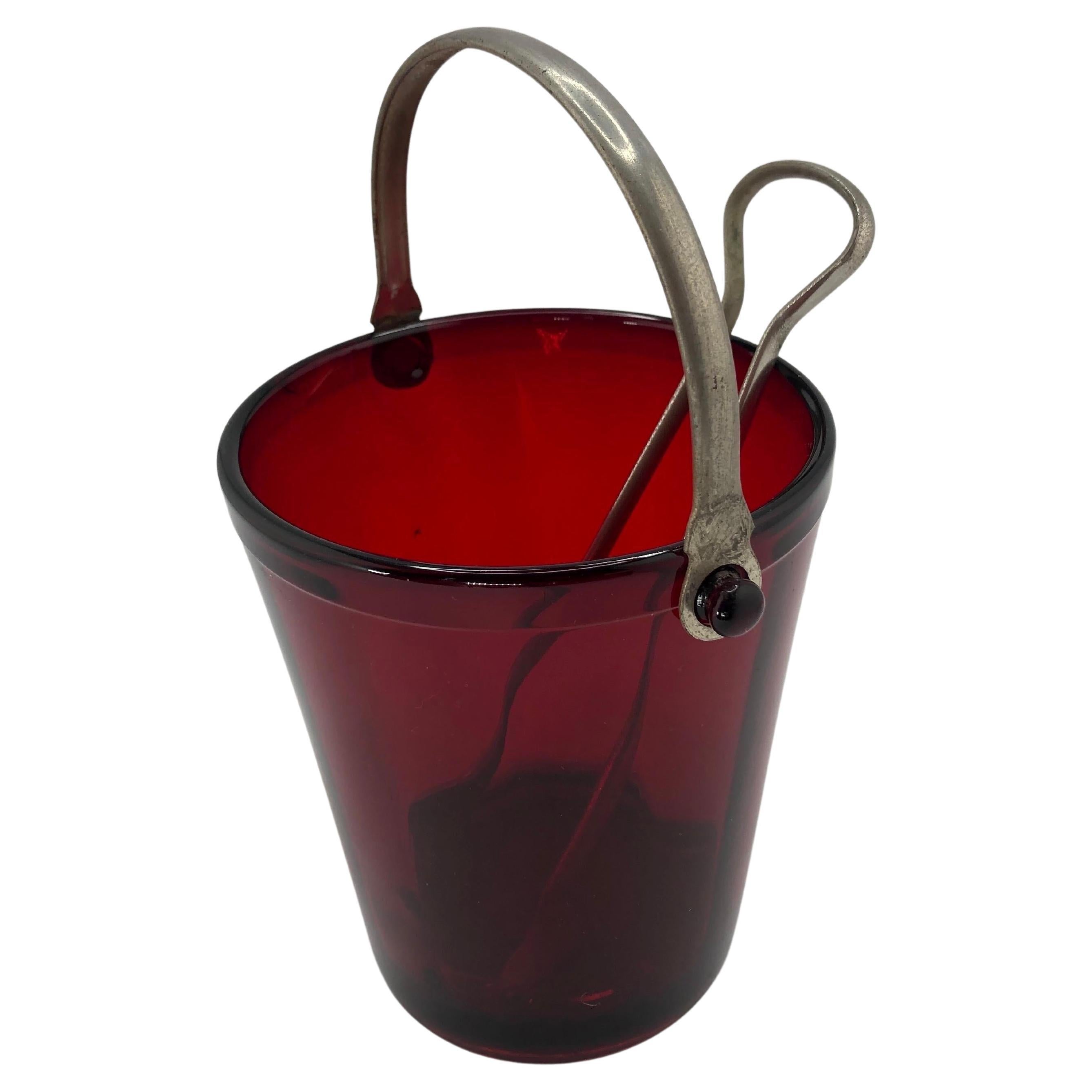 Art Deco Ruby Red Ice Bucket with chrome handle and ice tongs.