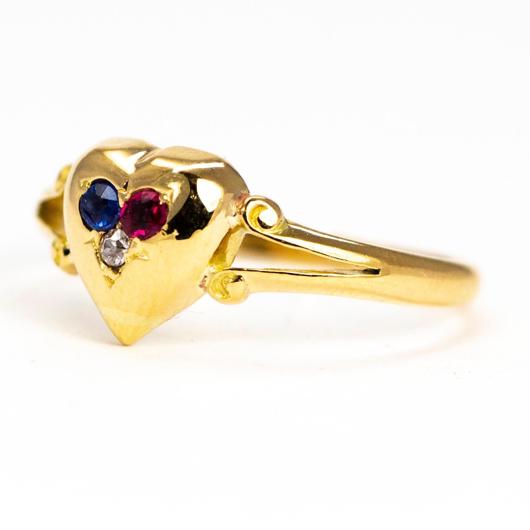 This sweet heart ring holds a trio of small yet stunning stones measuring 4pts each and the diamond measures 3pts. Included in this is a bright blue sapphire, deep pink ruby and a bright diamond. The bright yellow glossy 18 carat gold is crafted
