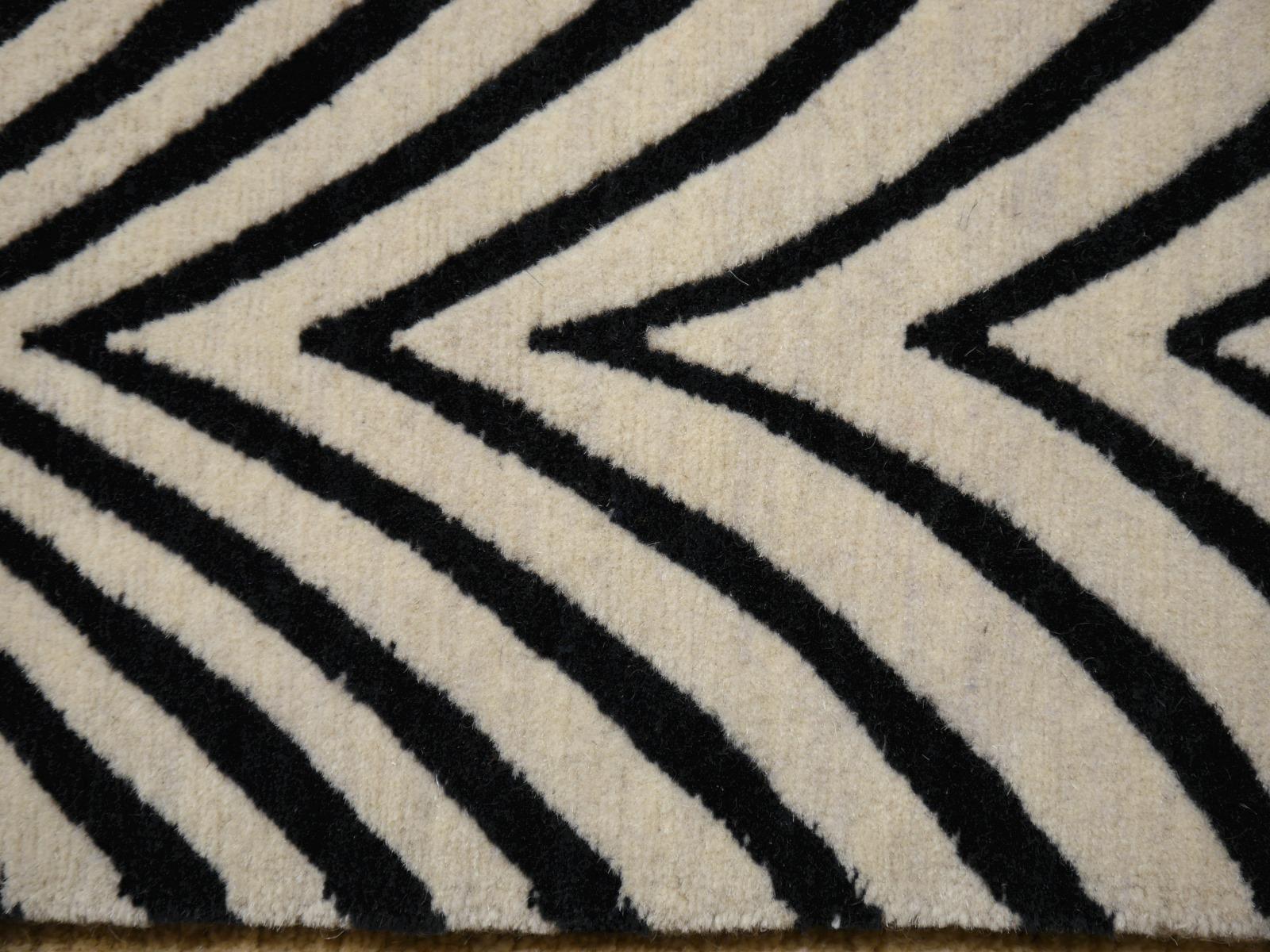 An Art Deco Zebra design rug, contemporary production, in style of antique Chinese rugs, hand knotted, using finest Tibetan highland wool.

Very fine wool and quality. 

Current production, other sizes can be made on order.

A real eye catcher. The