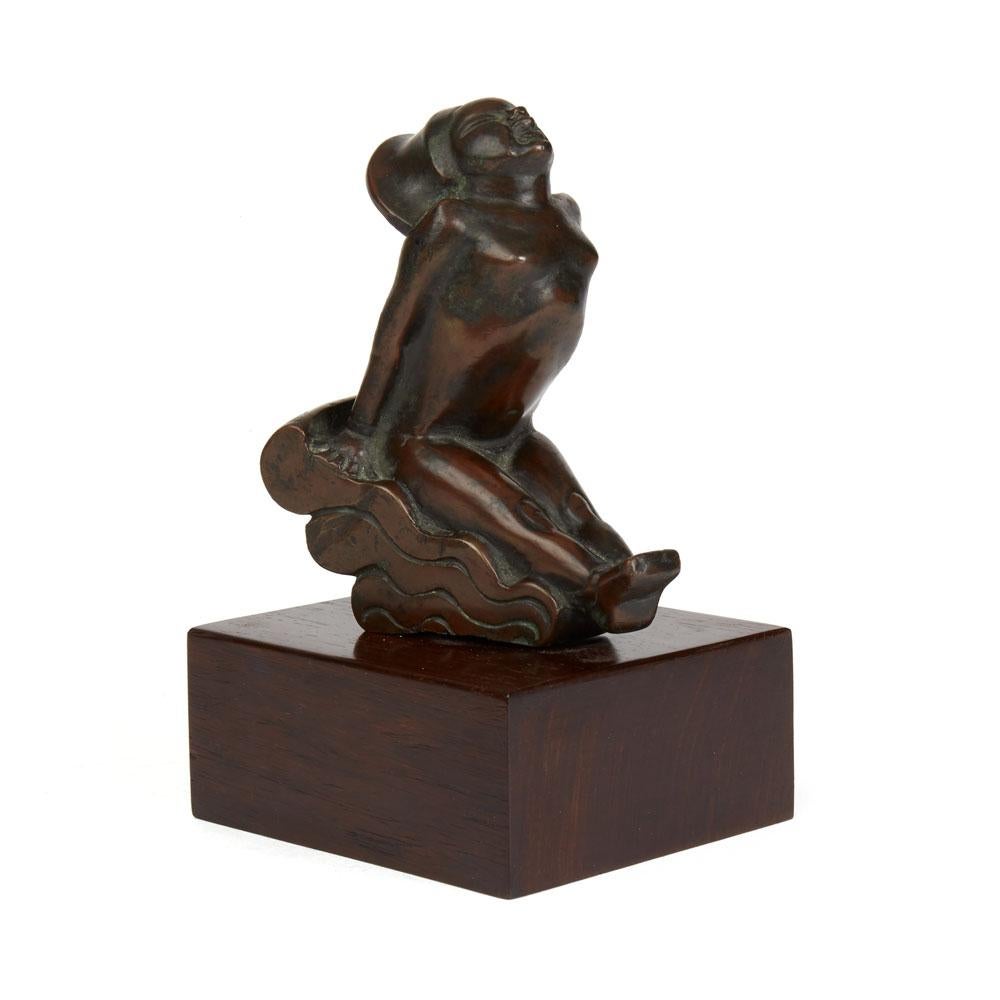 A fine Art Deco Russian bronze figure of a young naked girl floating on top of a wave by Bushka Kosminski. The figure is nicely detailed in typical period style and has a nice age patina to the bronze. The figure is mounted on a wooden base and is
