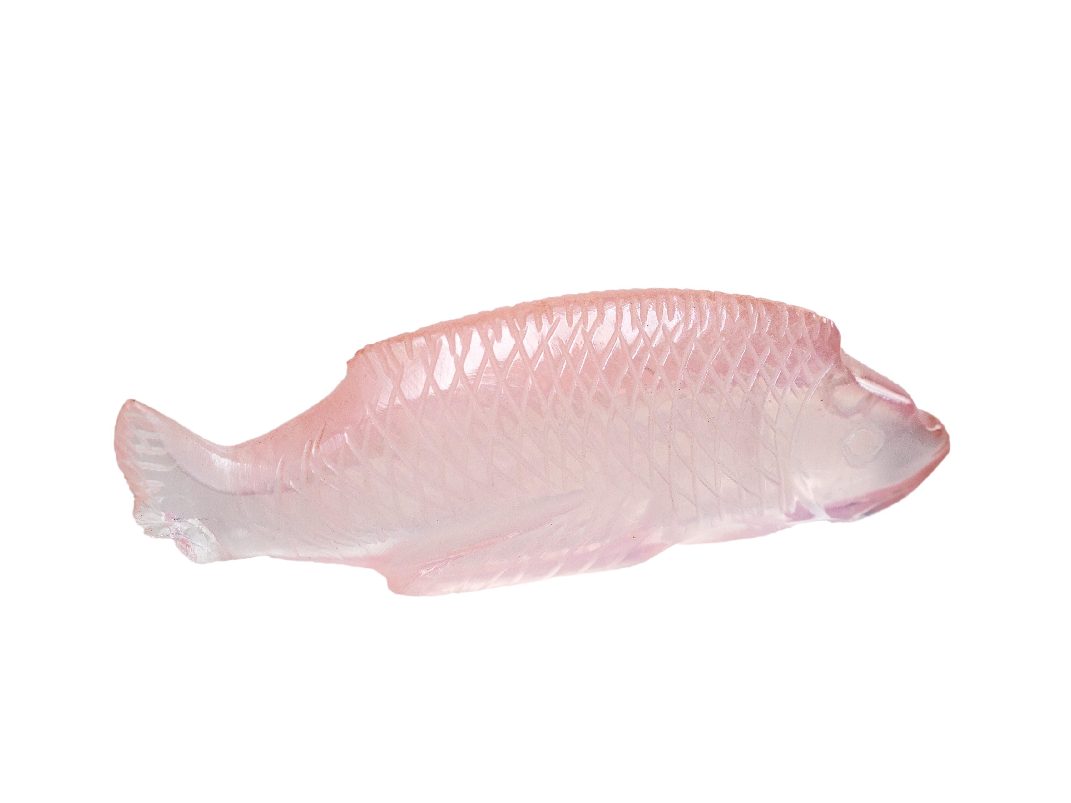 An exquisite French Art Deco pink opaline glass fish sculpture by Marius-Ernest Sabino, signed “Sabino”, dating from the 1930s.

This delicate miniature embodies the refined artistry of Sabino’s iconic glasswork. 
Crafted in soft pink opalescent