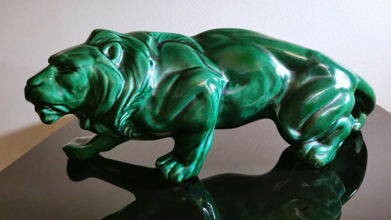 We kindly suggest you read the whole description, because with it we try to give you detailed technical and historical information to guarantee the authenticity of our objects.
Spectacular and large green ceramic lion glazed in Art Deco style, the