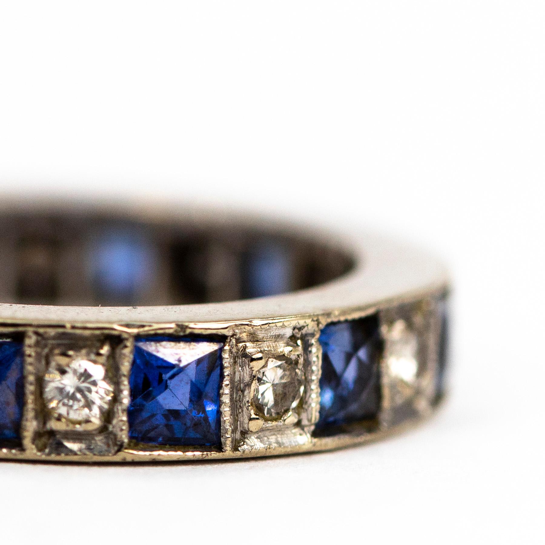This eternity band is chunky and features sapphires and diamonds all the way around. The sapphires measure 30pts each and the diamonds measure 5pts each. The diamonds are round cut and set in square settings and sapphires are square cut. 

Ring