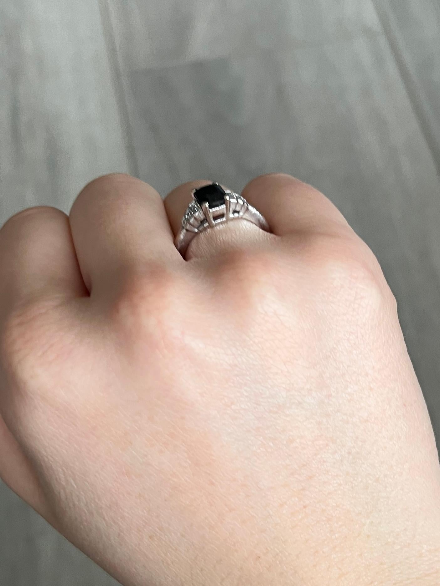 At the centre of this ring there is a gorgeous deep blue sapphire measuring 80pts and sat either side are bright baguette diamond step shoulders. The diamond total is 30pts.  

Ring Size: I 1/2 or 4 1/2 
Height Off Finger: 6mm 

Weight: 4.6g