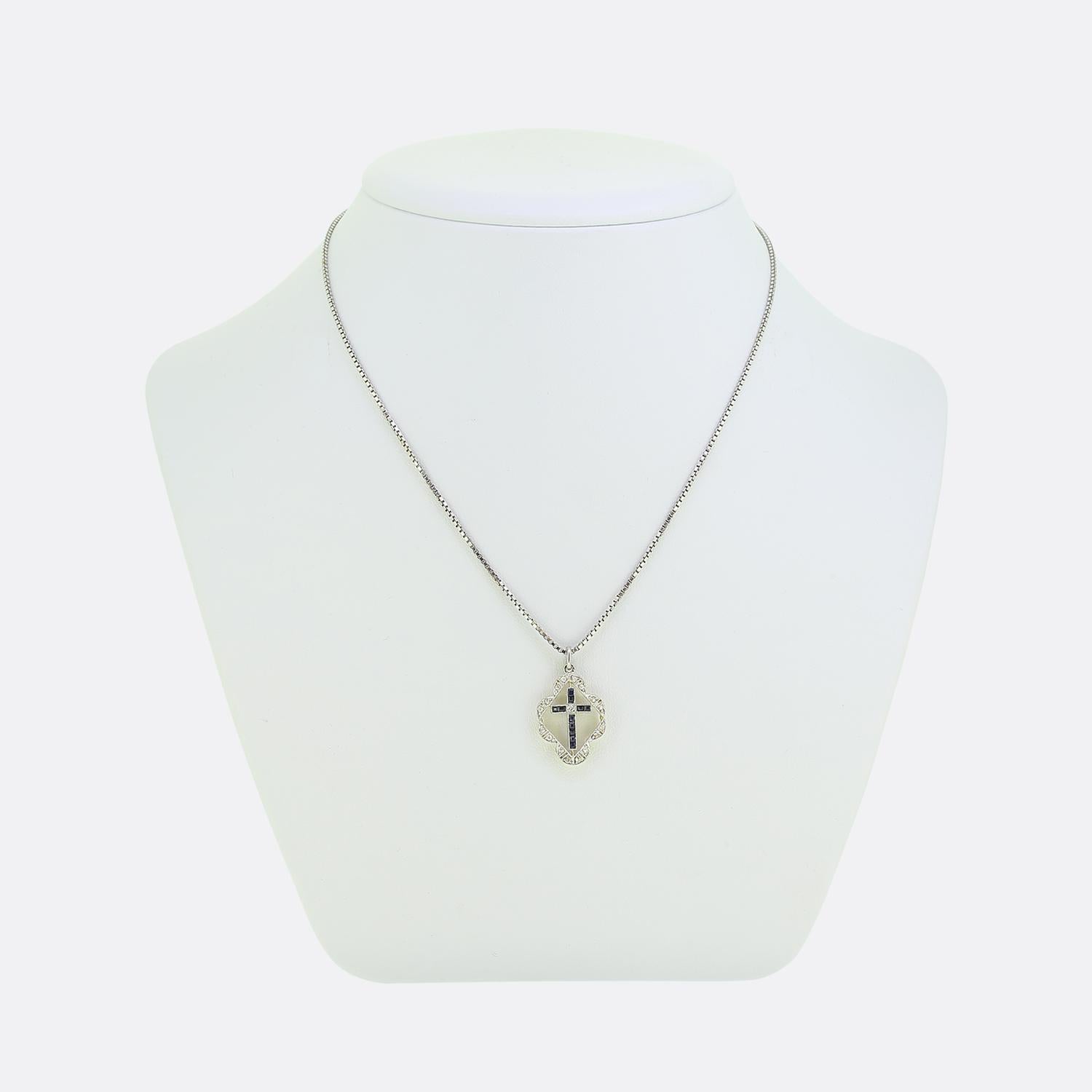 Here we have a truly wonderful cross that dates back to the Art Deco era. The pendant is crafted in 18ct yellow gold and platinum and features a central cross which is formed of rich blue sapphires and a central diamond. The cross is surrounded by a