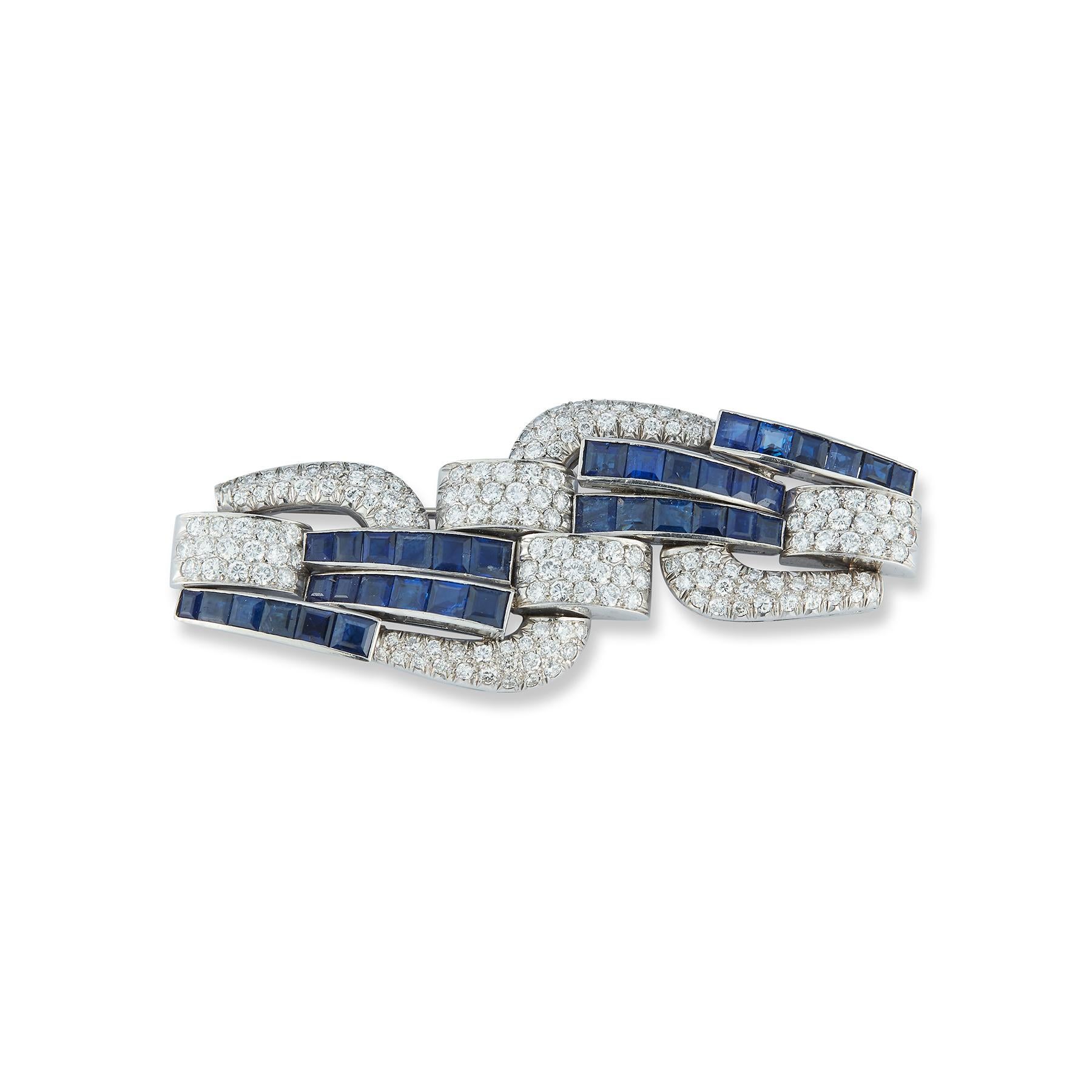 Art Deco Sapphire & Diamond Brooch 
Sapphires & Round cut Diamonds set in Platinum
Measurements: 2.75 inches long 