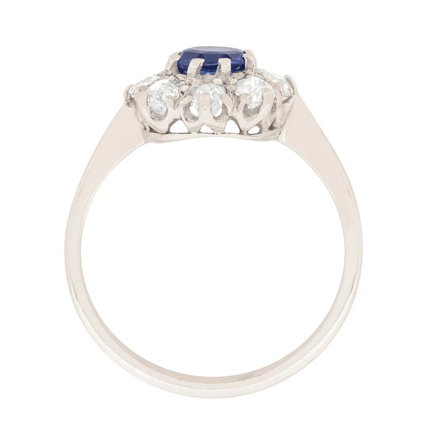 This beautiful halo ring shows off a lovely deep blue sapphire as the centre stone. It has a weight of 0.70 carats and has a halo of old cuts diamonds surrounding. The old cuts have a combined weight of 0.80 carats.

The centre sapphire is claw set