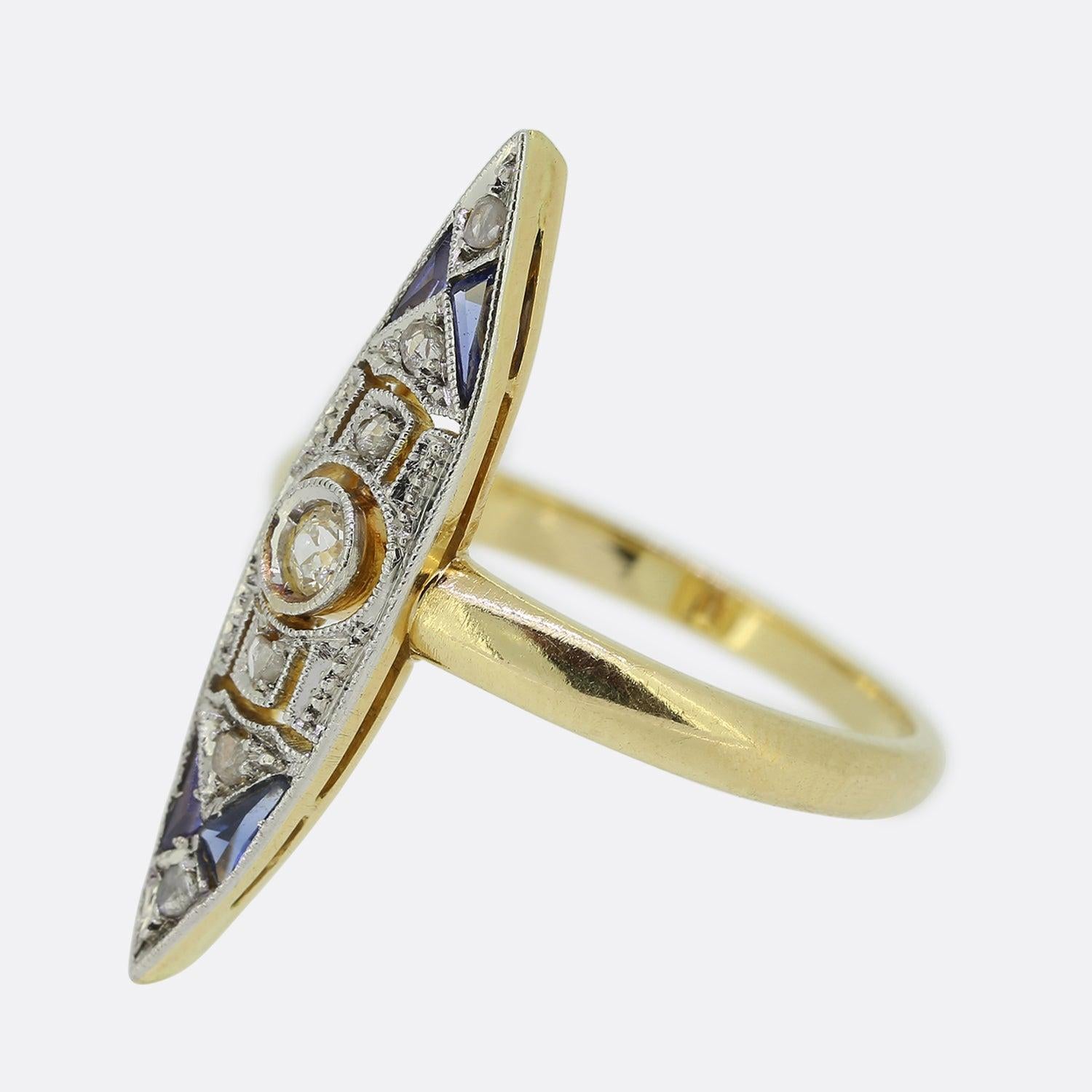 Here we have a Art Deco sapphire and diamond navette ring. This characterful piece presents a single old cut diamond at the centre within a milgrain setting; a feature consistent throughout the entirety of this open white gold faced design. Rose cut
