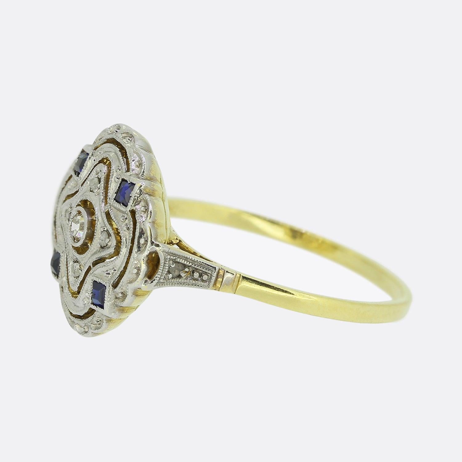 Here we have a excellently crafted sapphire and diamond plaque ring from a time when the Art Deco style was at the height of design. At the centre of the face we find a single round faceted old cut diamond which is surrounded by a trio of open