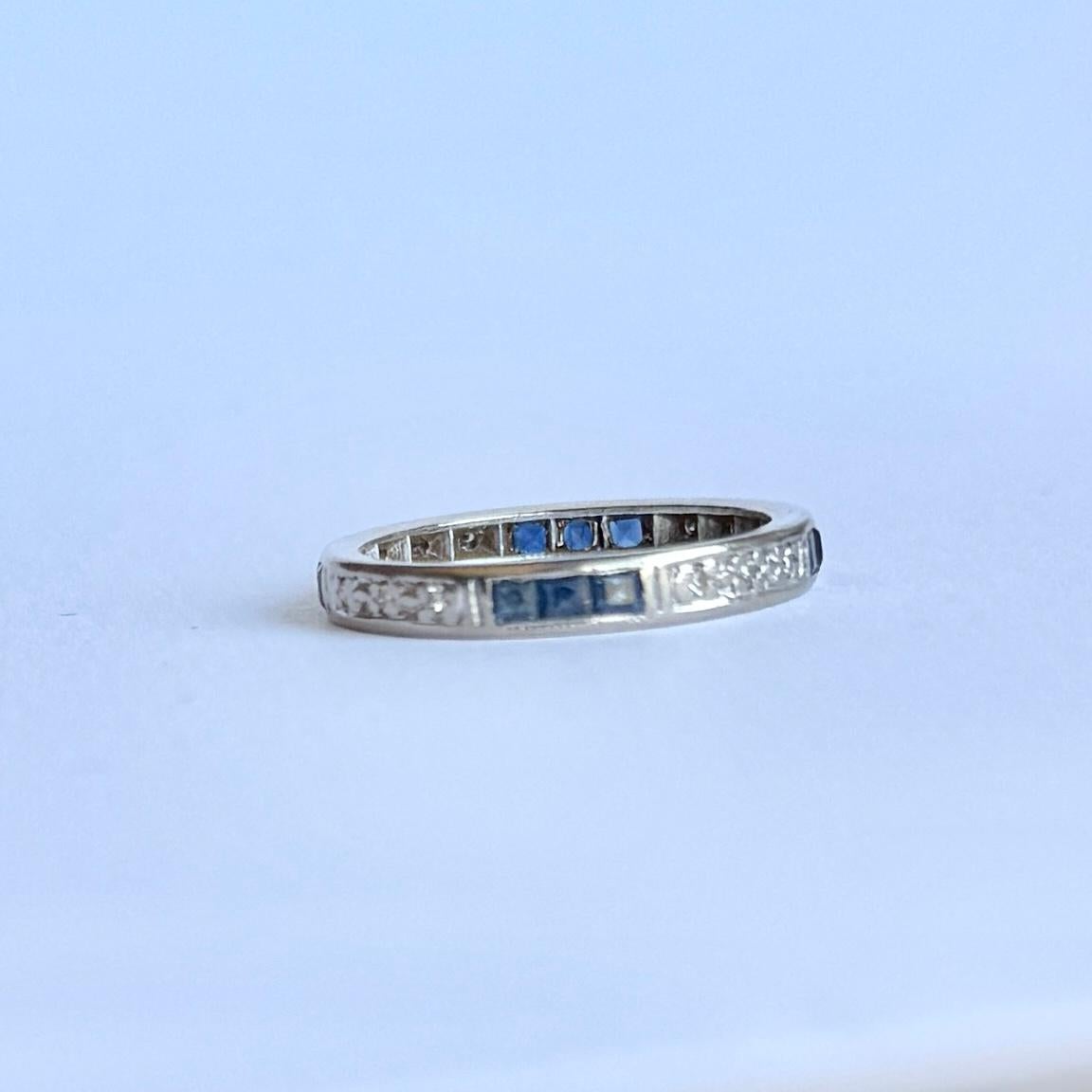 This sweet diamond and blue sapphire eternity has the stones set within the platinum band. The stones are grouped in collections of three diamonds and three sapphires. The diamonds measure approx 2pts each and the sapphires measure approx 4pts each.