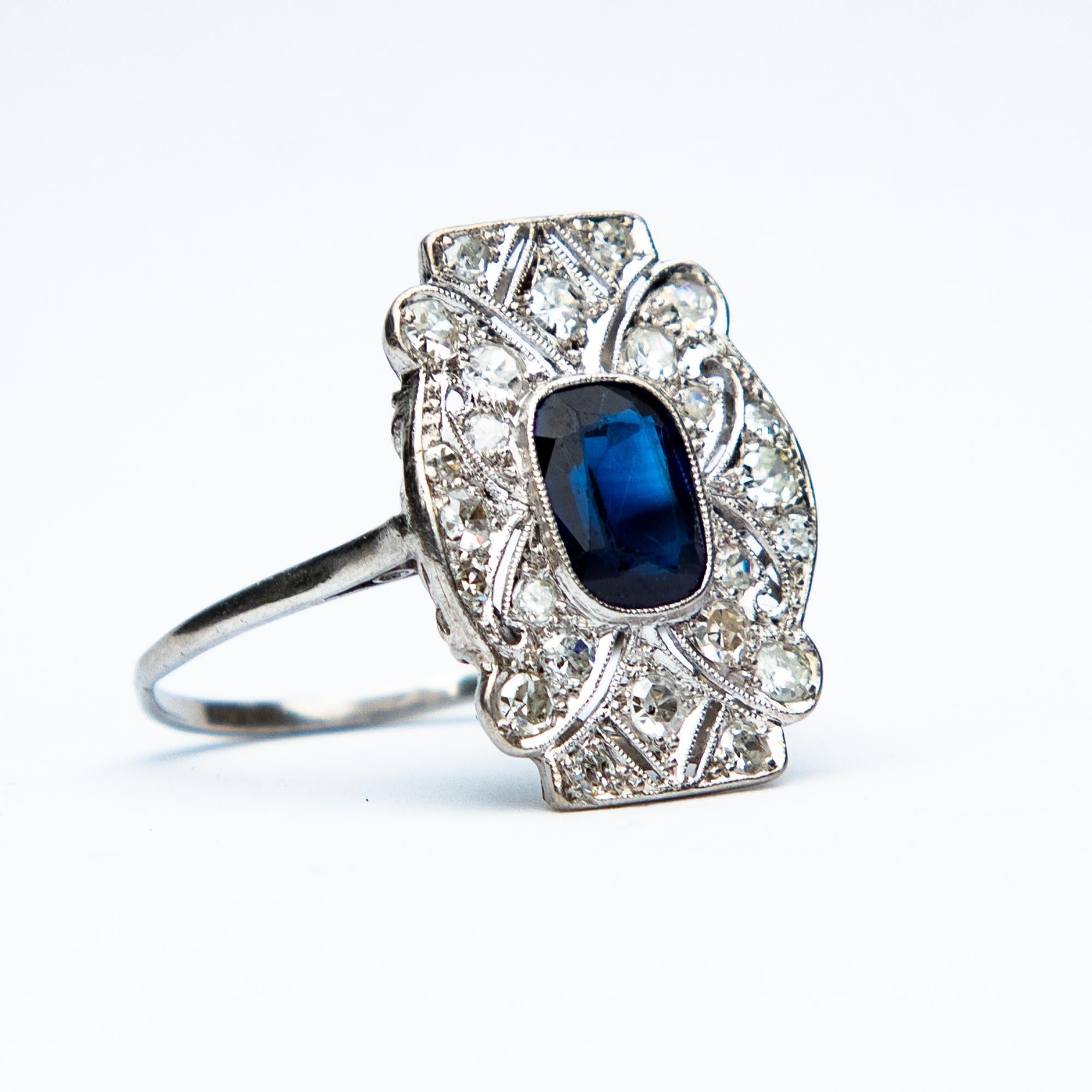 An astounding Art Deco Diamond and Natural Sapphire ring. 
The central sapphire measuring eighty five points, surrounded by old European cut Diamonds and sapphire accented corners. This wonderful piece is Platinum set.
The Diamonds are H colour and