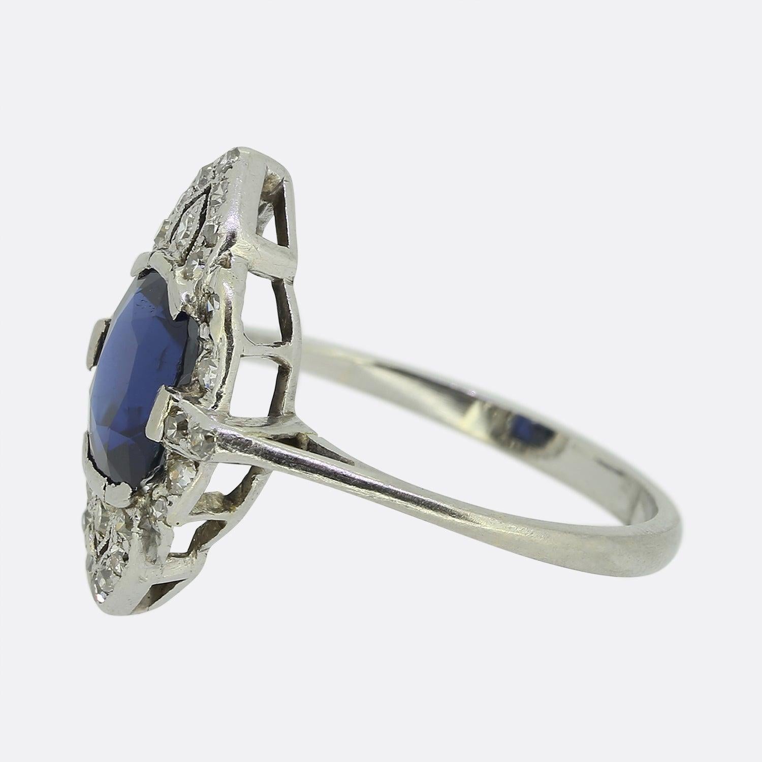 Here we have a wonderful sapphire and diamond ring that dates back to the Art Deco era. The ring is crafted in platinum and the focal point is a mid to dark blue sapphire that has been verbally authenticated as showing no indications of heat