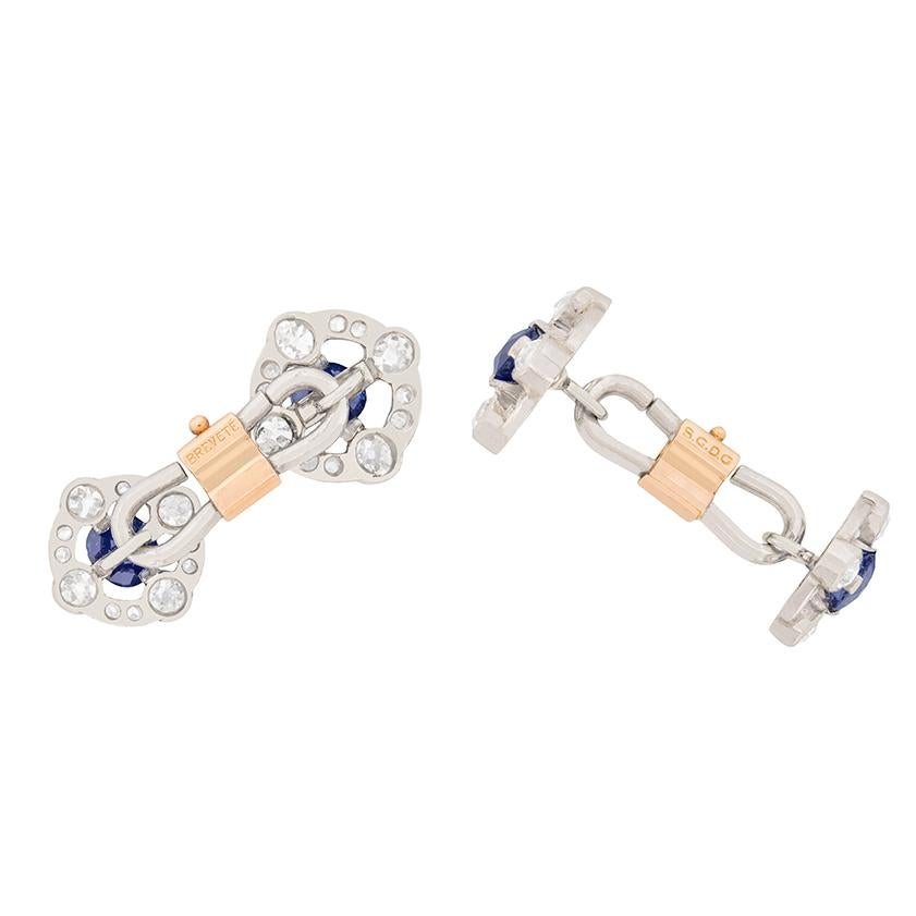 All handmade and dating back to the 1920s, these cufflinks feature deep blue sapphires and with a halo of diamonds. The natural sapphires each weigh 0.10 carat, 0.40 carat in total and the combined weight of the sparkling old cut diamonds comes to