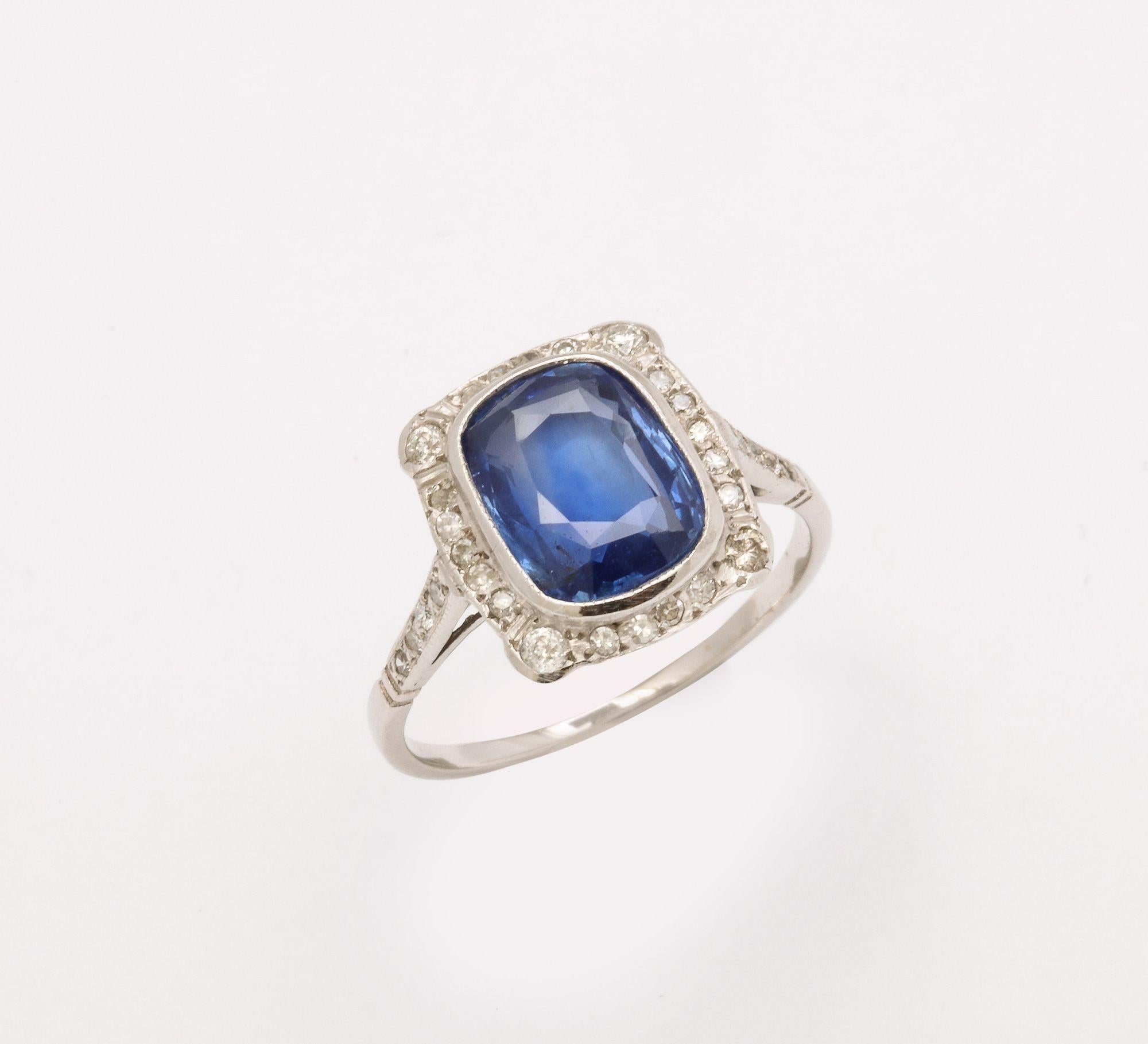 A beautiful delicate Art Deco Sapphire and Diamond white gold Ring. with a 2.50  ct cushion cut Natural sapphire surrounded by a halo of old mine cut diamonds.
