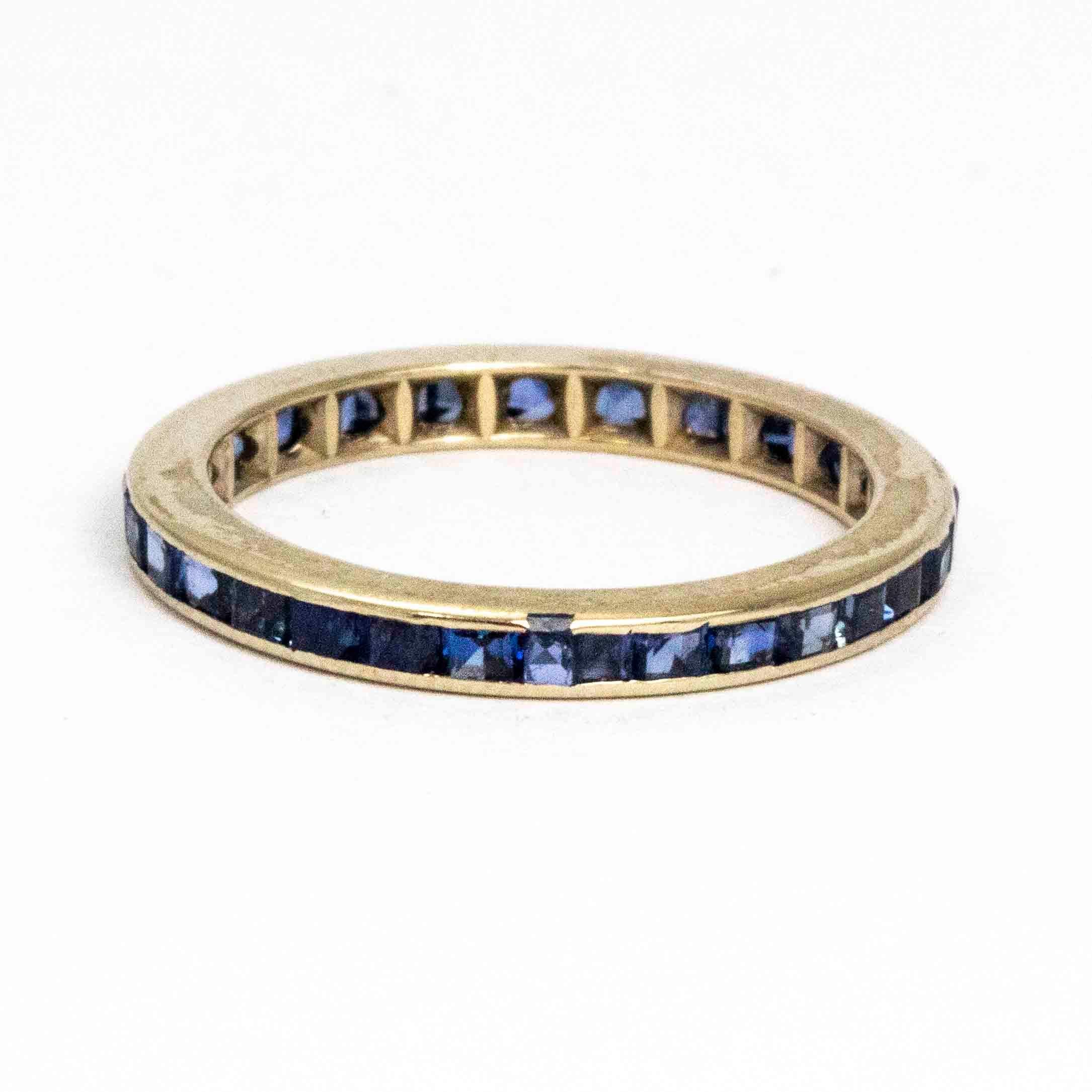 This gorgeous platinum eternity ring encases gorgeous deep blue sapphires all the way around it. The stones measure approximately 5pts each. These full eternity bands work brilliantly as a stack or equally as beautiful worn alone. 

Size J 1/2 or 5