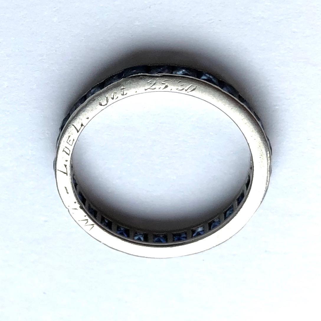 This band make a great alternative to a wedding band to a great everyday wear ring that you could stack. The ring holds sapphires all the way around with each stone measuring approx 10pts. There is engraving on the face of the band reading 'W.D