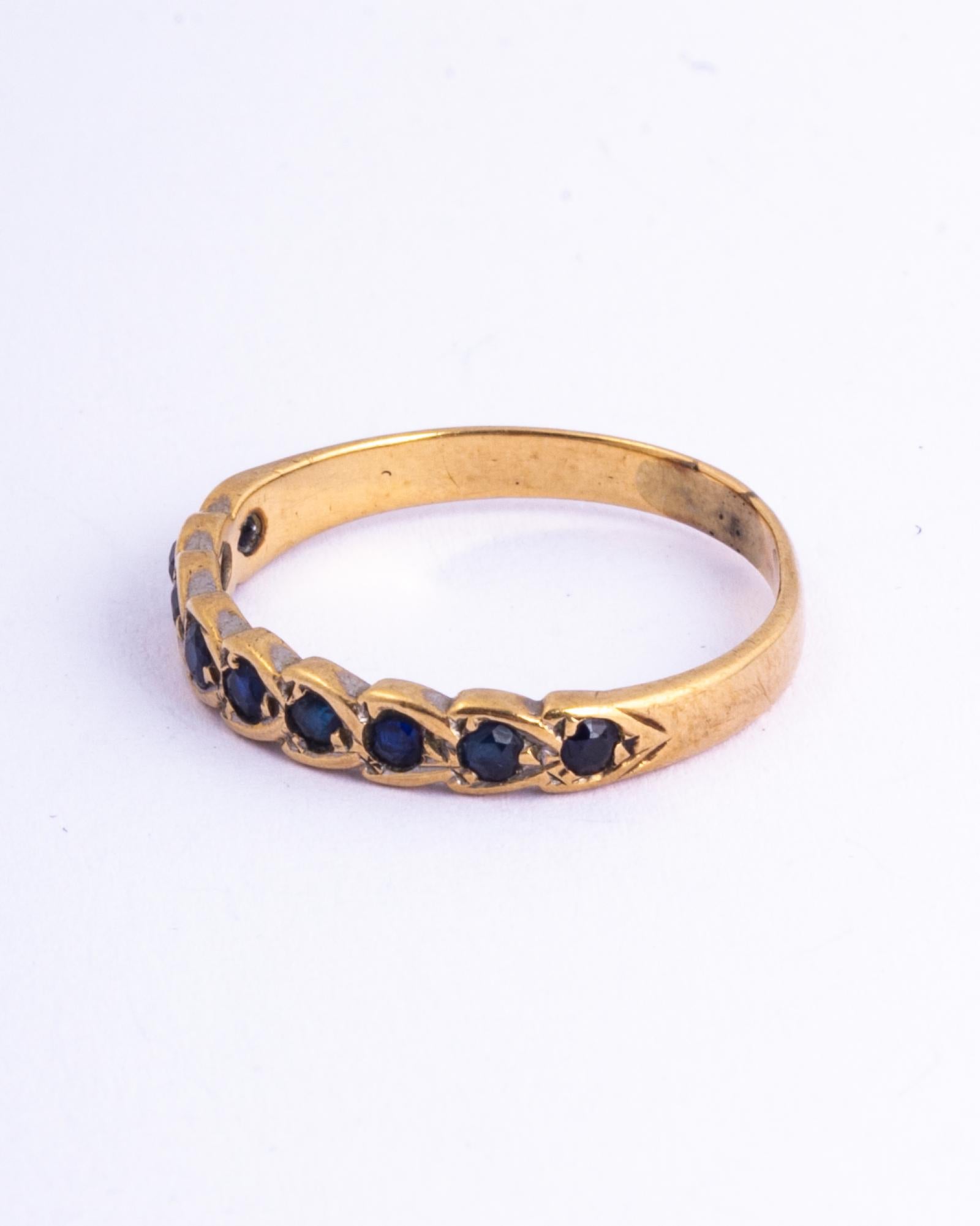 The nine sapphires in this band measure approx 4pts each. The stones are set within an engraved platinum band. Made in Birmingham, England. 

Ring Size: N or 6 3/4
Band Width: 3mm

Weight: 1.5g