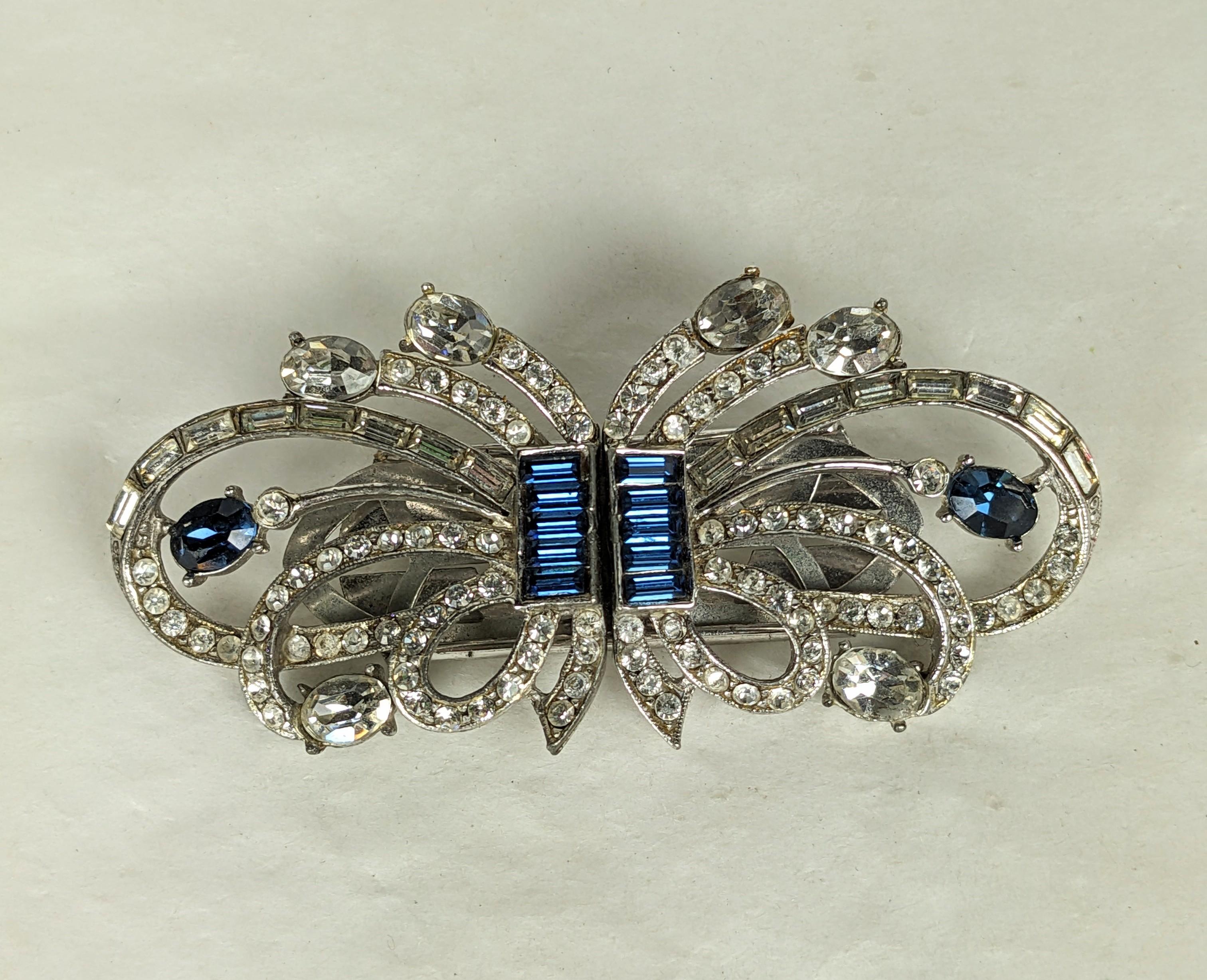 Art Deco Sapphire Baguette Duette Brooch from the 1930's. High Art Deco design with pave crystal and sapphire baguettes and ovals. Clips separate off frame to form 2 dress clips for lapels or neckline. Unsigned. 1930's USA. 3