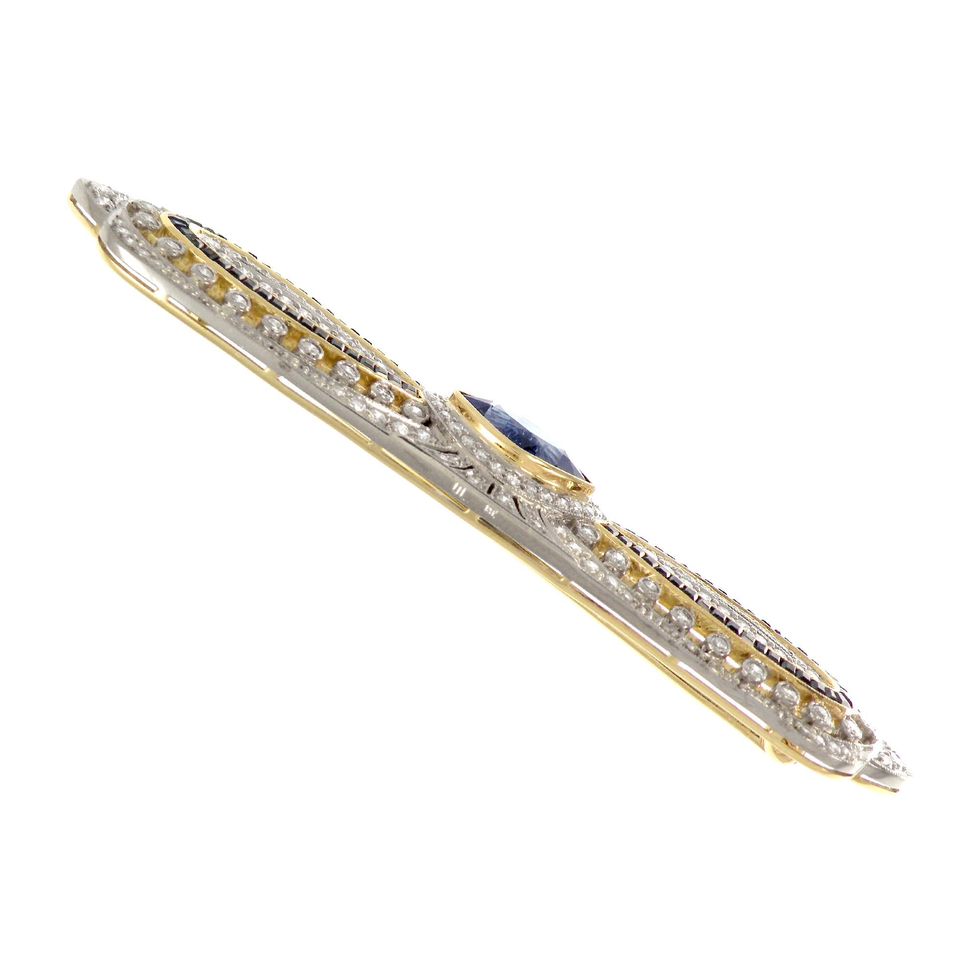 
One-of-a-kind piece, with the beautiful filigree work and fine mill grain setting. This is a two tone brooch handcrafted in 18K Yellow gold and white gold. This brooch features beautiful marquise sapphire of 2.37 carats at the center, 4.71 carats