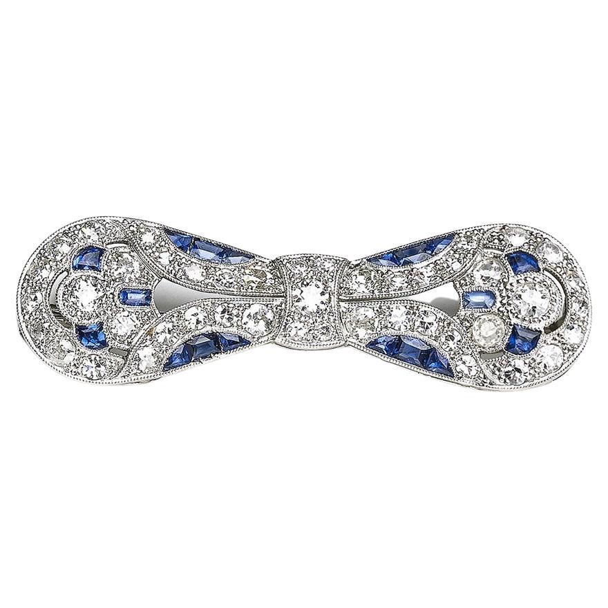 Art Deco Sapphire, Diamond And Platinum Bow Brooch, Circa 1930 For Sale