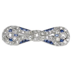 Art Deco Sapphire, Diamond And Platinum Bow Brooch, Circa 1930