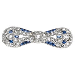 Art Deco Sapphire, Diamond And Platinum Bow Brooch, Circa 1930