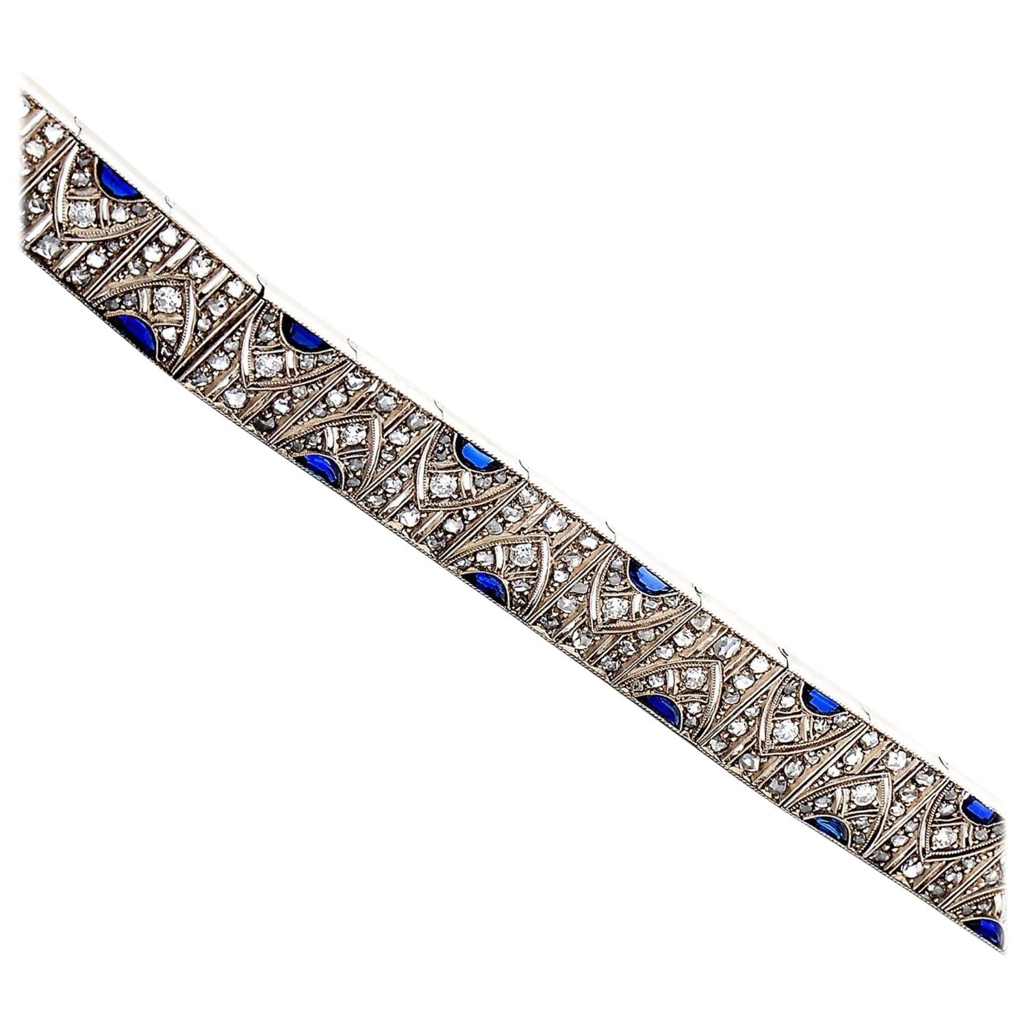 Art Deco Synthetic* Sapphire and Diamond Geometric Bracelet in Platinum and Gold, Portugal, 1920s-1930s, Signed by Tinoco & Irmão. This antique bracelet is designed as a sequence of 17 openwork geometric squared panels depicting a cathedral motif,