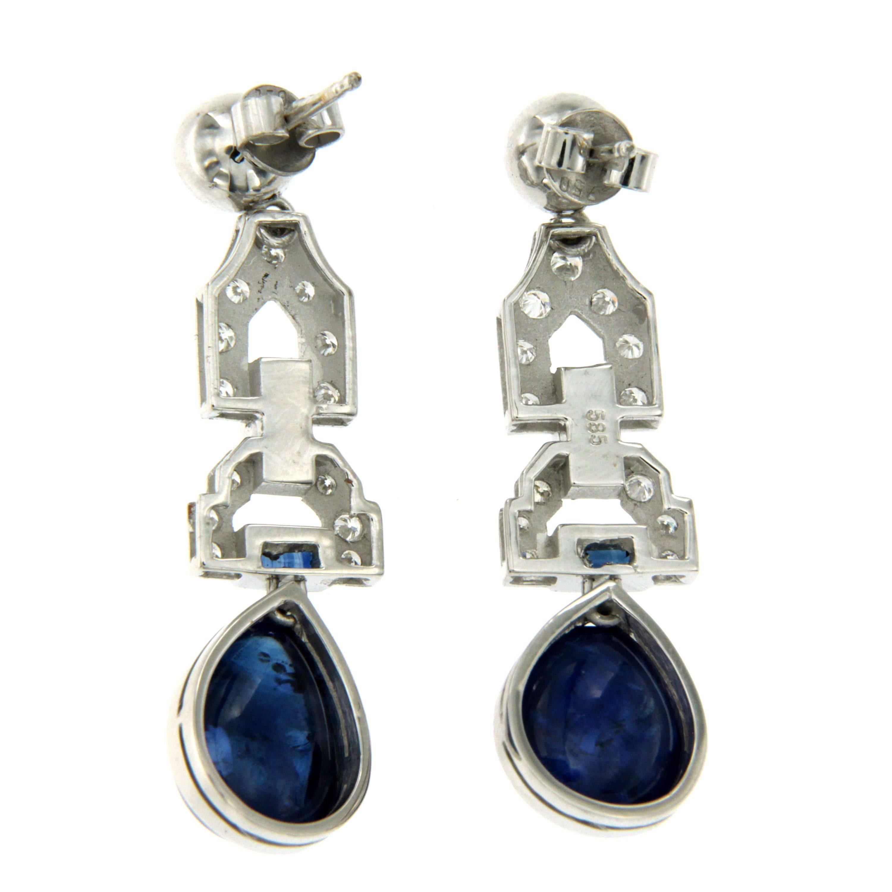 These Beautiful Art Deco 14k white gold earrings feature at the bottom 2 large teardrop cabochon natural deep blue Sapphire weighing approx. 14 carats, connected by open links set with 2 custom cut Sapphire and colorless round Diamonds weighing