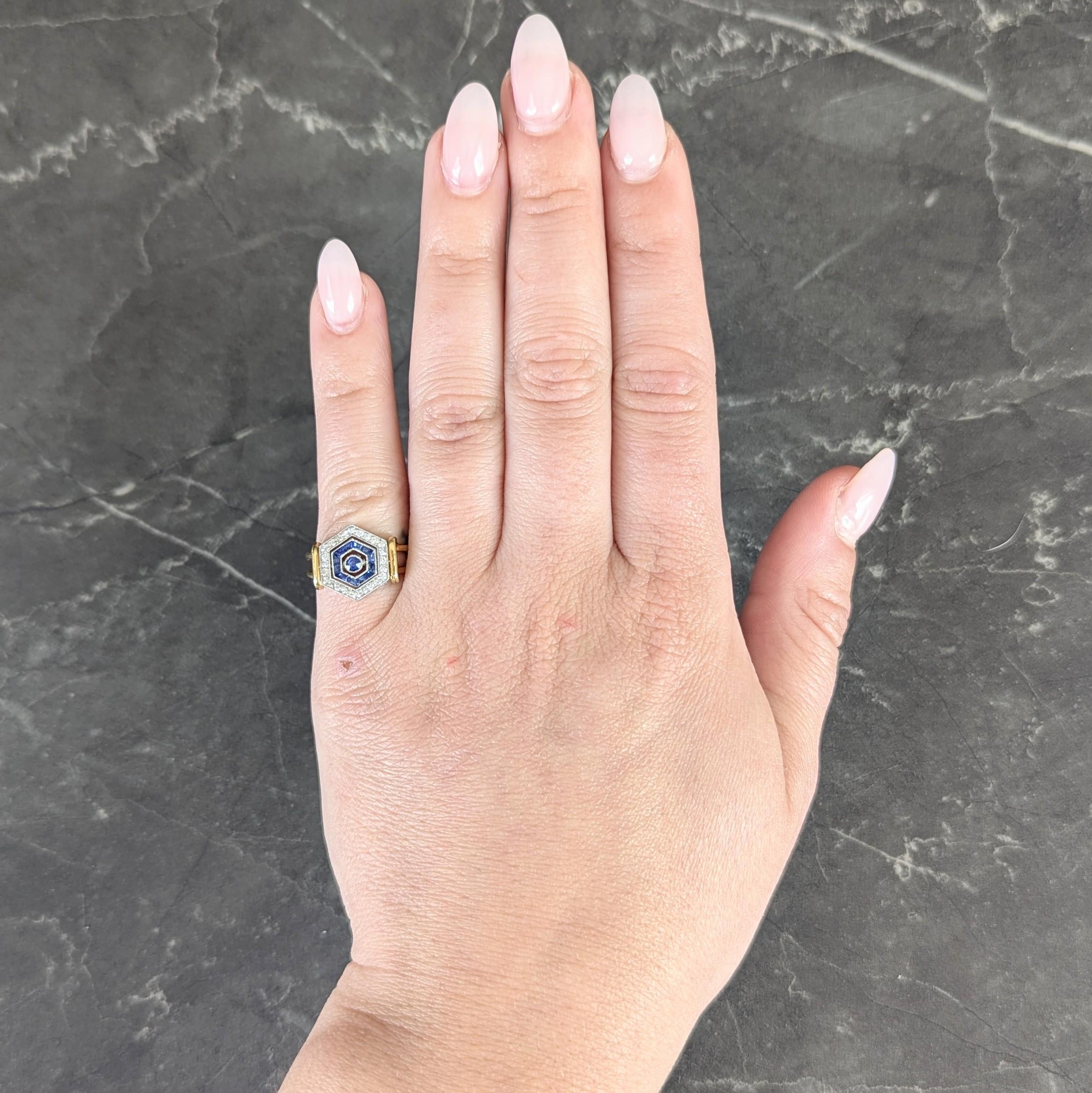 Designed as a hexagon shaped platinum form head with three flippable segments allowing for a range of stylings
Each segment is bezel, channel, and bead set with diamonds on one side and sapphires on the other
Center segment features a single old