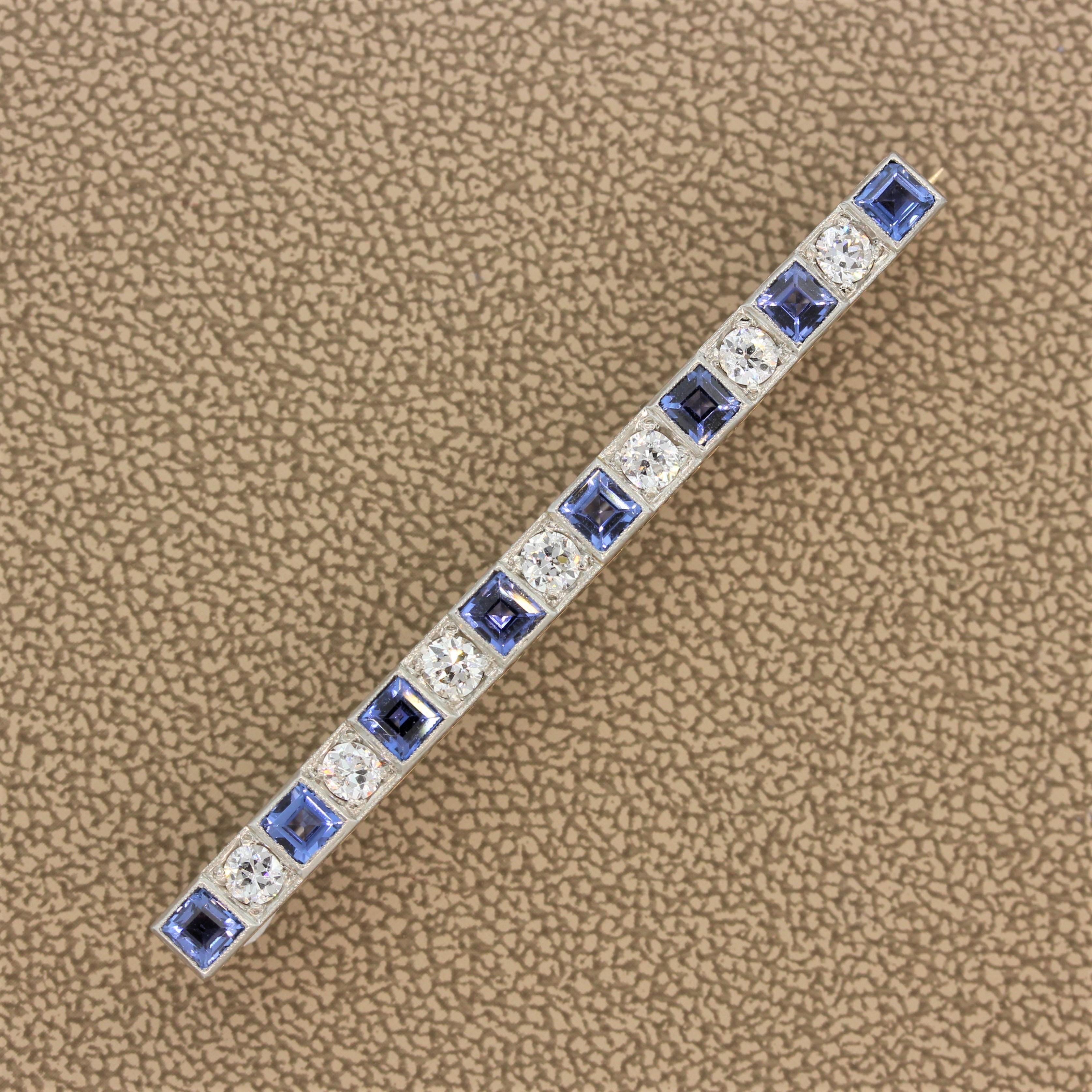 A lovely Art Deco bar pin featuring o European cut diamonds alternating with princess cut blue sapphires set in platinum. The pin is hand-fabricated in 14k yellow gold which is topped with platinum.

Brooch Length: 2.25 inches
Brooch Width: 0.20