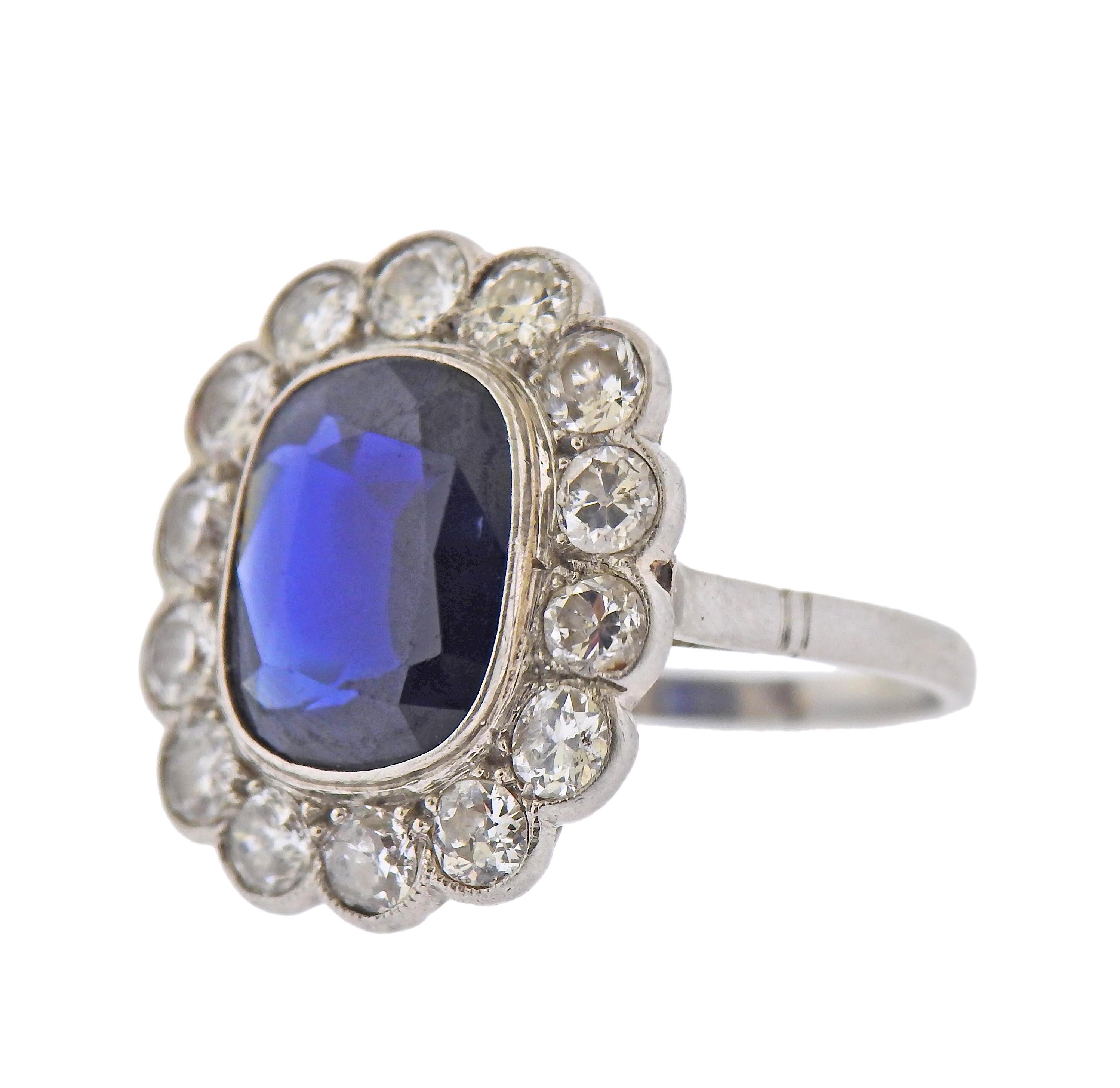 Art Deco platinum ring, with center 11.7mm x 9mm x 4.2mm sapphire, surrounded with approx. 1.40ctw in diamonds. Ring size - 5.75, ring top - 20mm x 18mm. Tested plat. Weight - 5.4 grams. 