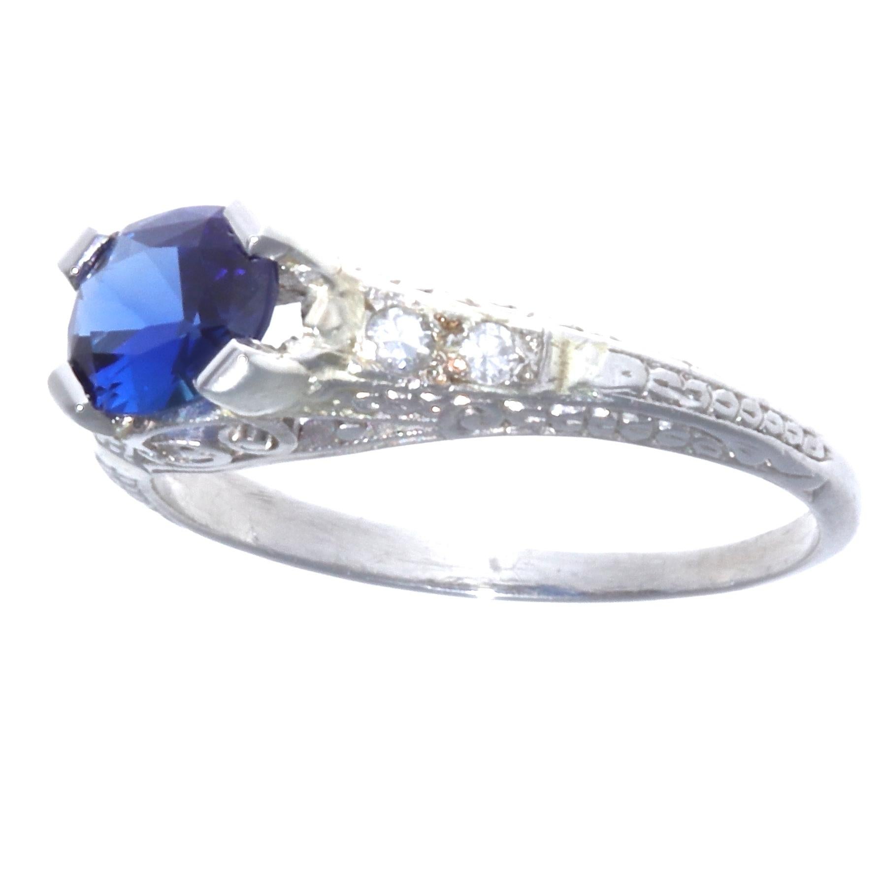 So elegant and fun! Just like an Art Deco flapper girl. Wear this ring to a party, or every day to stand out from the crowd. The filigree on the band make it extraordinary and one of a kind. The ring features a cushion cut sapphire approx 0.70