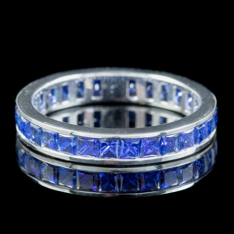 A beautiful Art deco full eternity ring from the 1920s modelled in solid 18ct white gold and calibre set with a full band of French cut blue sapphires weighing approx. 0.08ct each (2.30ct total).  

It’s truly mesmerising and boasts a gorgeous array