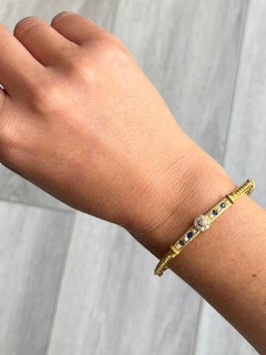 Art-Déco-Armreif aus 18 Karat Gold mit Saphiren, Perlen und Diamanten