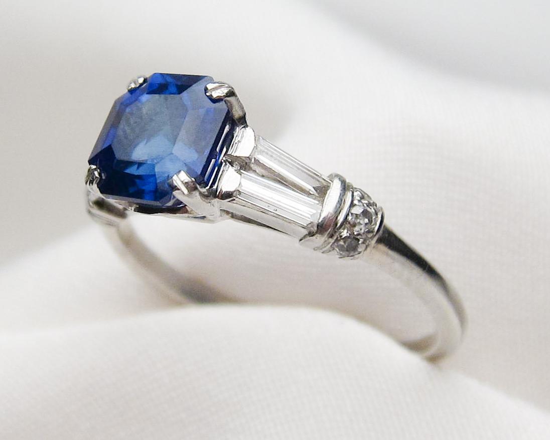 Emerald Cut Art Deco Sapphire Platinum Ring with Baguette Diamond Accents For Sale