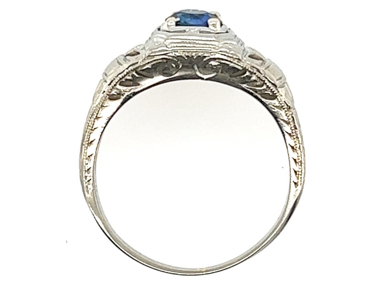 Genuine Original Art Deco Antique from 1930's Vintage Sapphire Ring 1/2ct Round Solitaire 18K White Gold 


Featuring a Vivid Blue .50 Carat Genuine Natural Round Sapphire Center

Hand Engraved Pattern Lines Each Side 

Milgrain Details 

Numbered