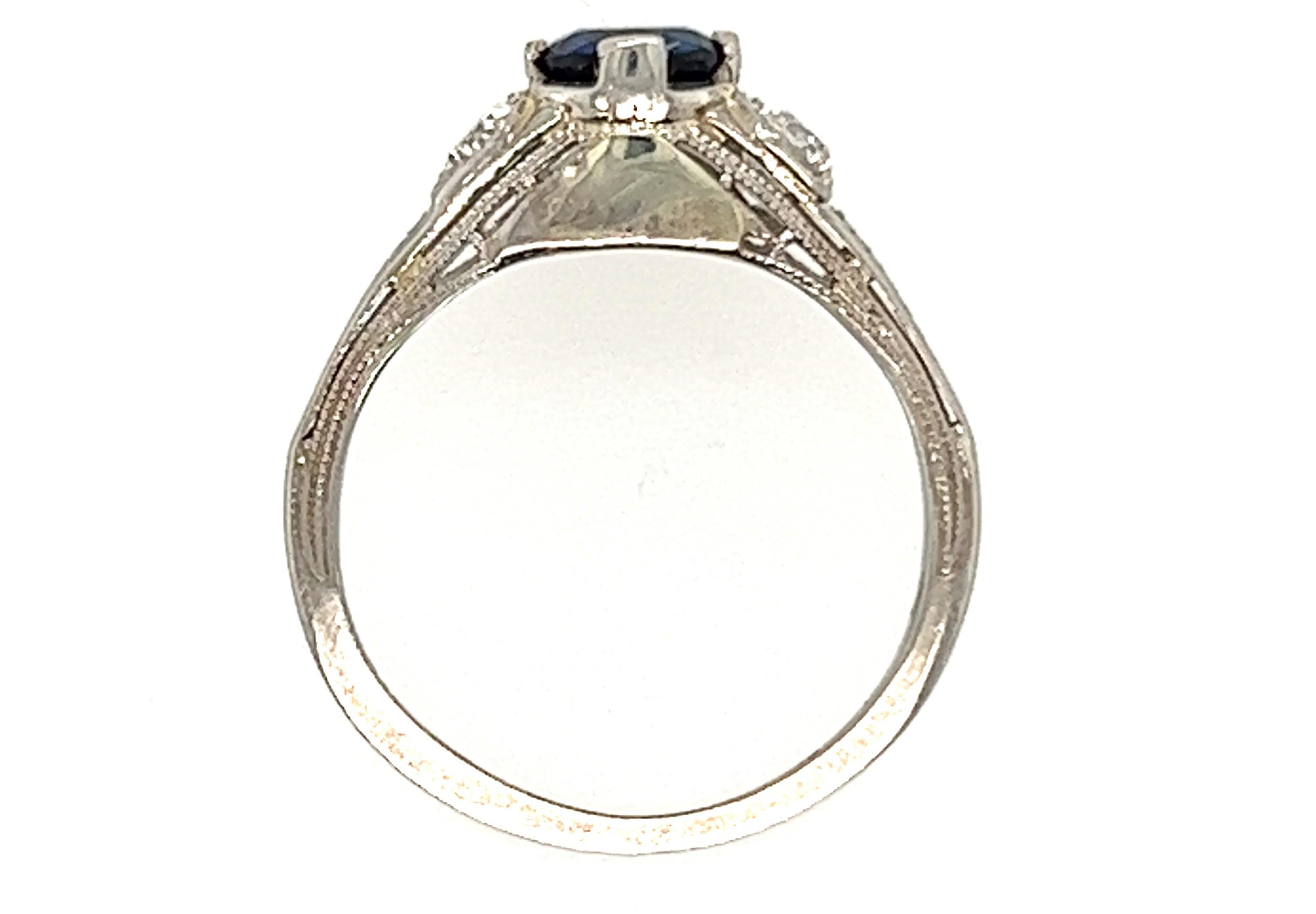 Genuine Original Art Deco Baskin Brothers Antique from 1930's Vintage Sapphire Diamond Ring .86ct 18K White Gold 


Featuring a Midnight Blue .61 Carat Genuine Natural Round Sapphire Center

2 Large Genuine Old European Cut Natural Mined Diamonds