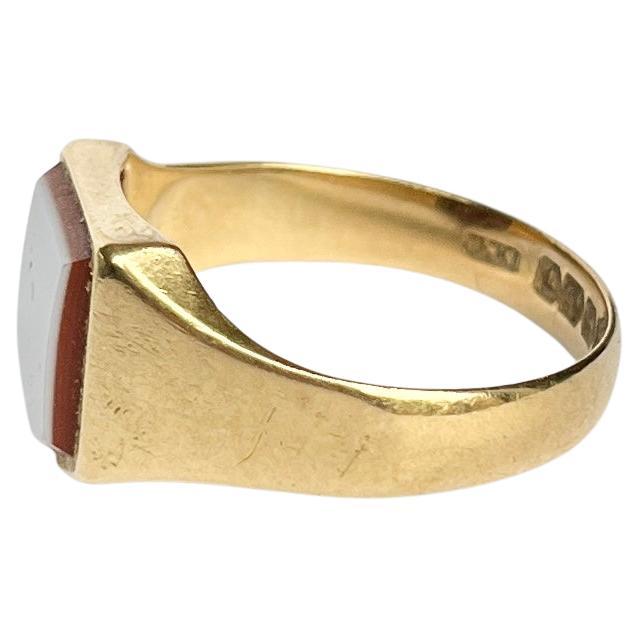 A superb signet ring, set with a brilliant shield cut sardonyx and modelled in 18carat yellow gold. Hallmark Birmingham 1927.

Ring Size: U or 10
Stone Dimensions: 11x9mm

Weight: 6.2g